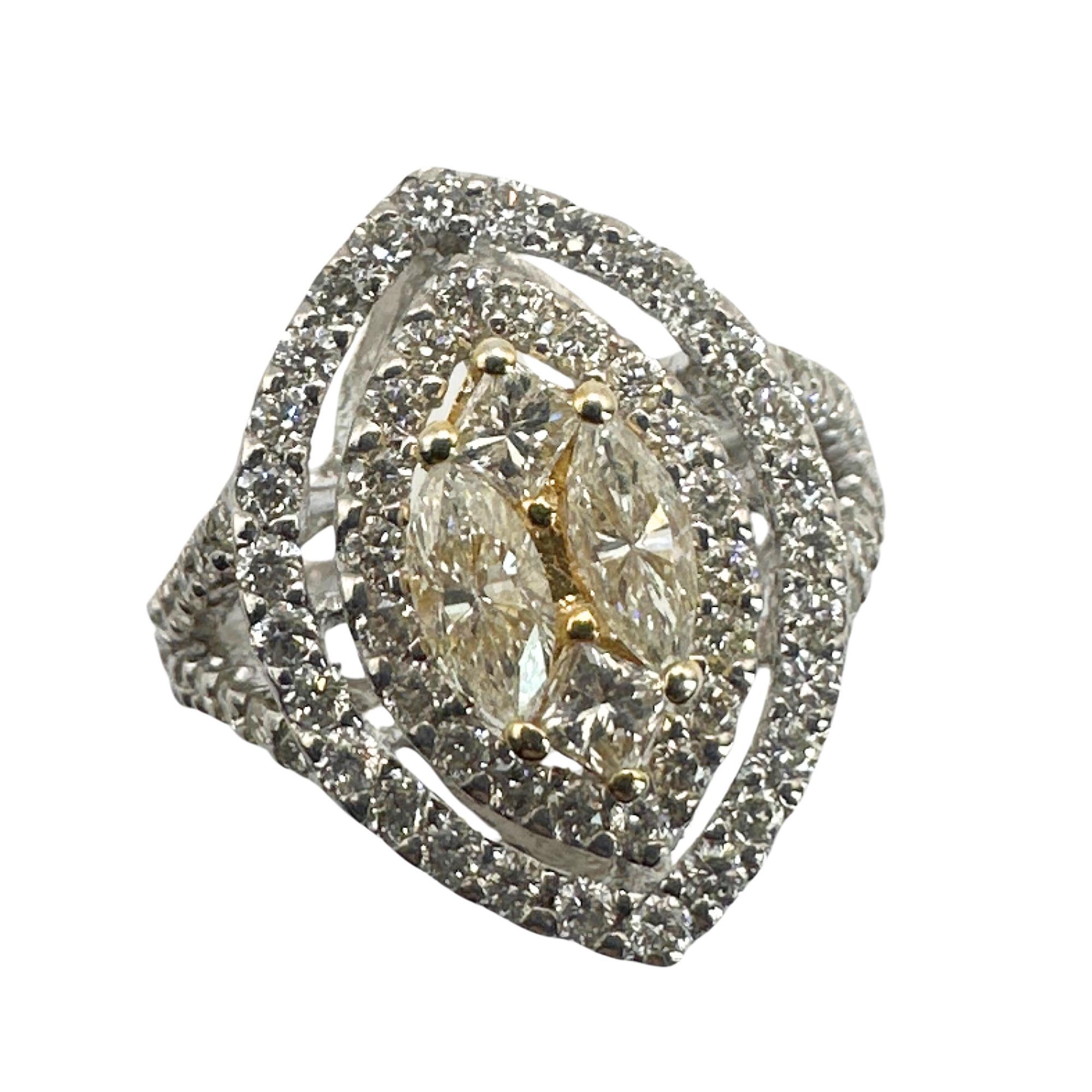 Introducing our 18k Marquise and Princess Cut Diamond Ring. Crafted from luxurious white and yellow gold, this elegant ring features a stunning combination of round, marquise, and princess cut diamonds, totaling 1.45 carats. In excellent condition