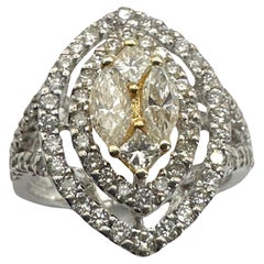 Anello con diamanti taglio marquise e principessa in 18k