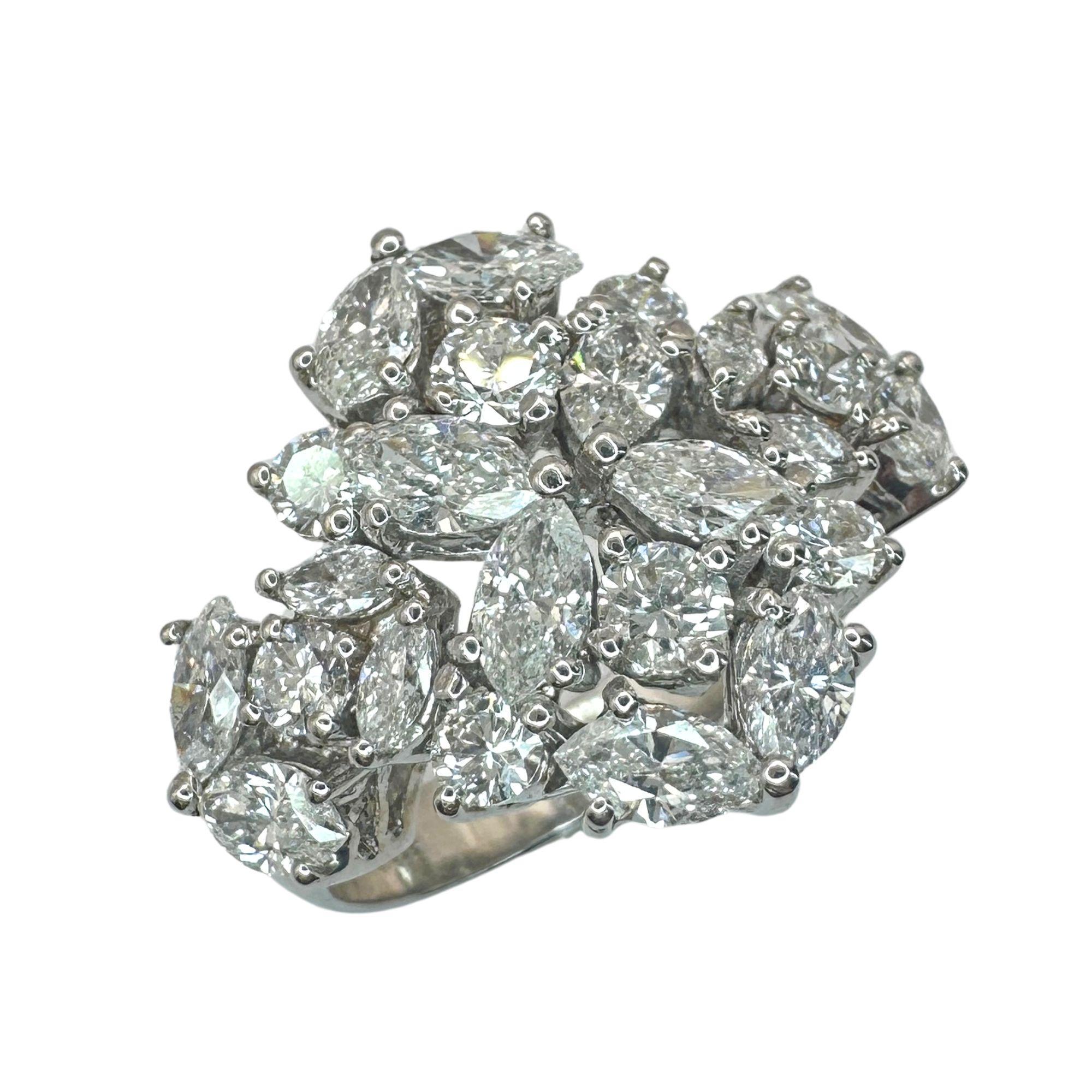 This 18k White Gold Marquise Cut Diamond Ring is a timeless piece in good condition. With 1.99 carats of marquise cut diamonds and 0.74 carats of diamond accents, it is sure to make a statement. Weighing 7.4 grams and marked with 
