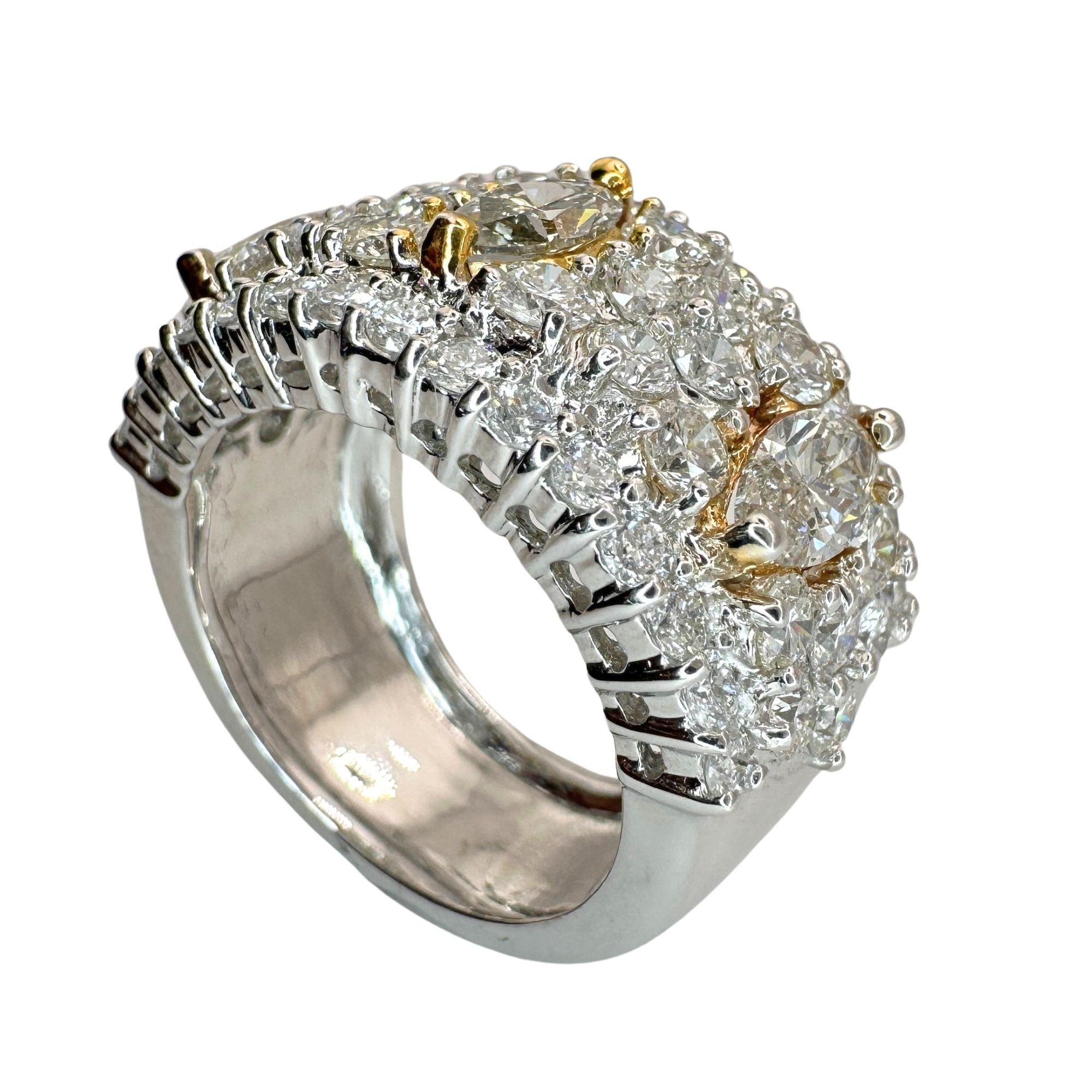 Treat yourself to pure elegance with our 18k Marquise Cut Diamond Wide Band Ring. Crafted with 18k white and yellow gold, this ring is in good condition with minor surface wear. The marquise cut diamonds, totaling 1.18 carats, glisten alongside 2.54