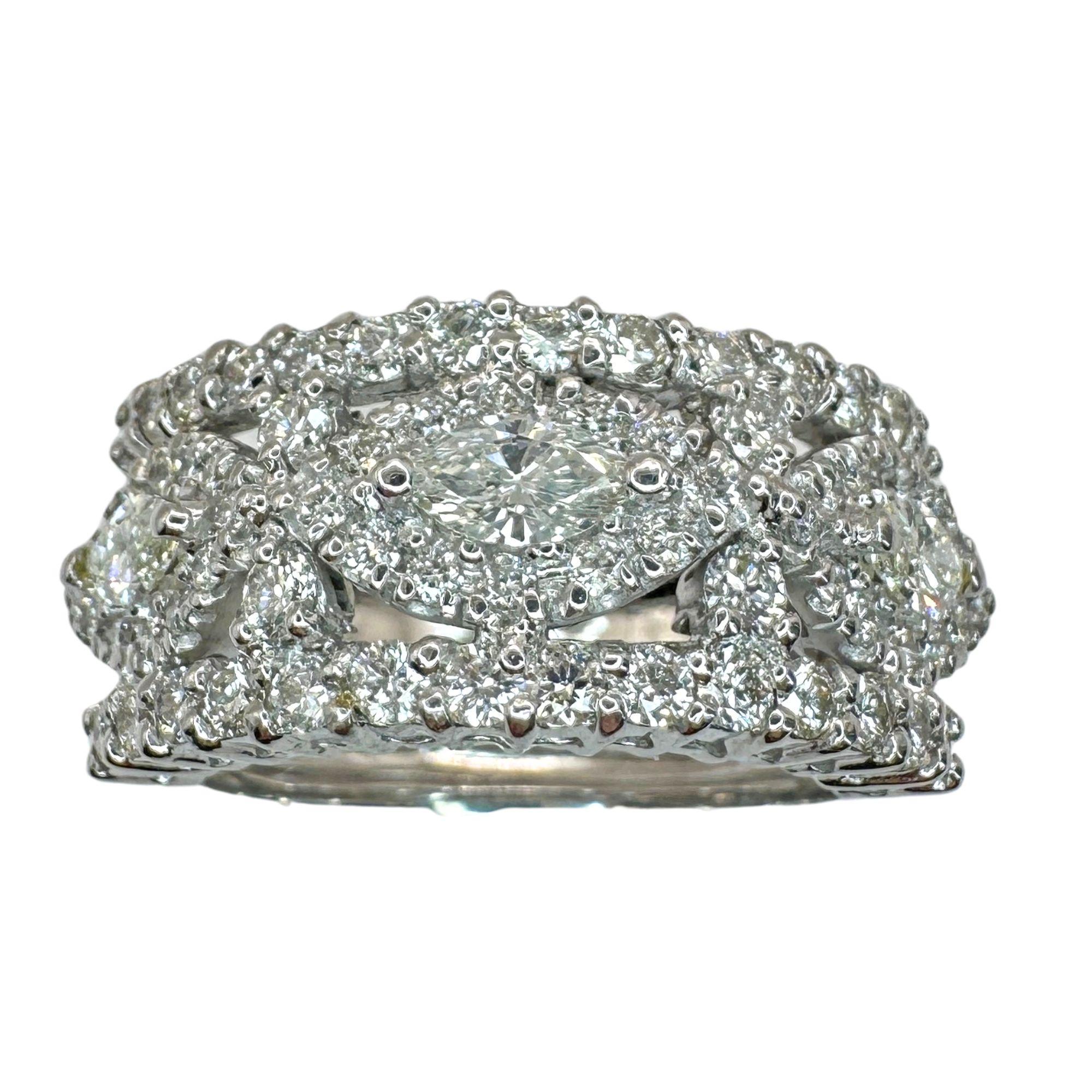 Indulge in ultimate luxury with our 18k Marquise Cut Wide Band Diamond Ring. Crafted from 18k white gold, this ring exudes elegance with a 1.68 carat marquise cut diamond and intricate markings. With a width of 11.01mm and weighing 9.3 grams, it's
