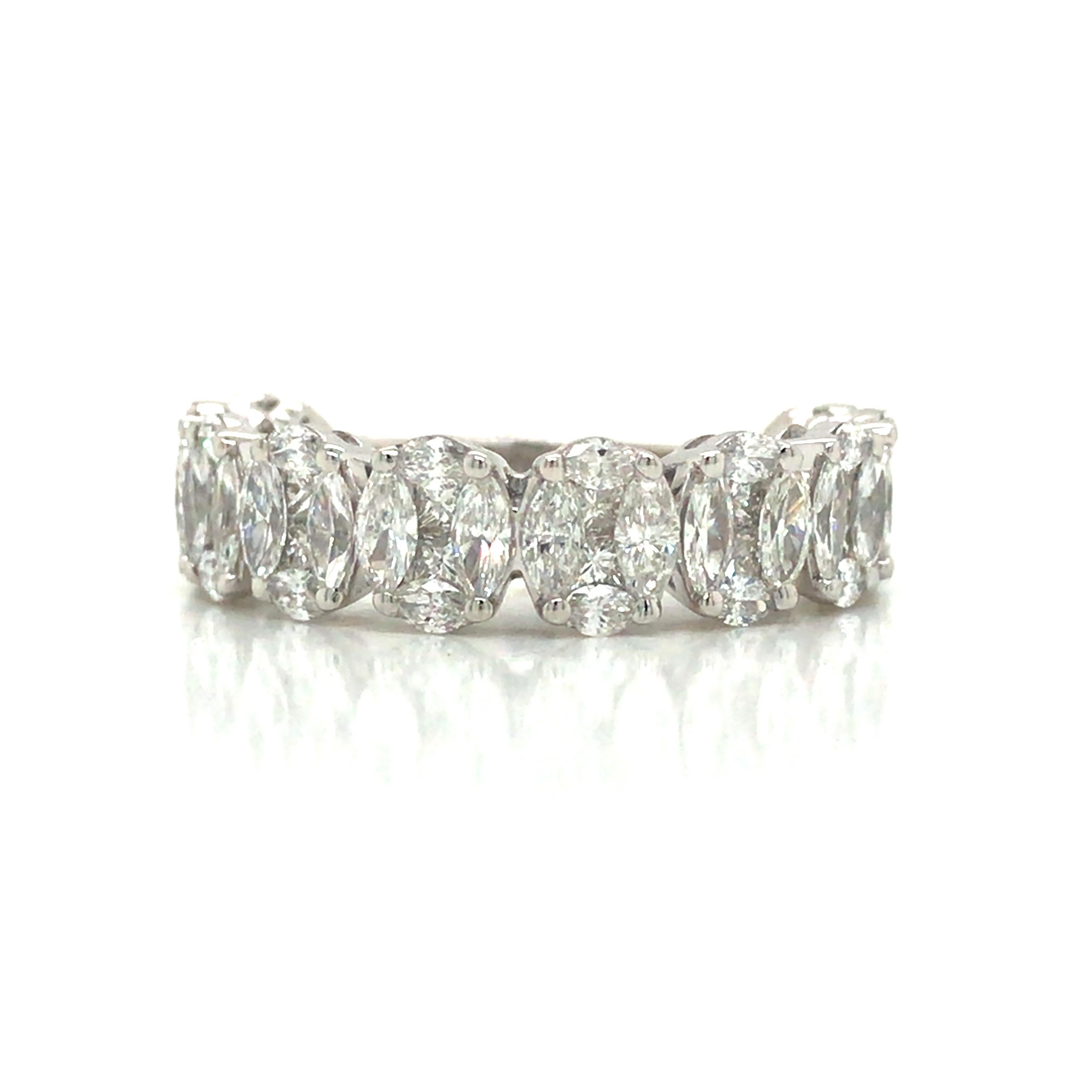 Marquise and Princess Cut Diamond Oval Cluster 3/4 Eternity Band in 18K White Gold.  Marquise and Princess Cut Diamonds weighing 2.52 carat total weight, G-H in color and VS in clarity are expertly set on Oval Shape Clusters.  The Ring measures 1/4