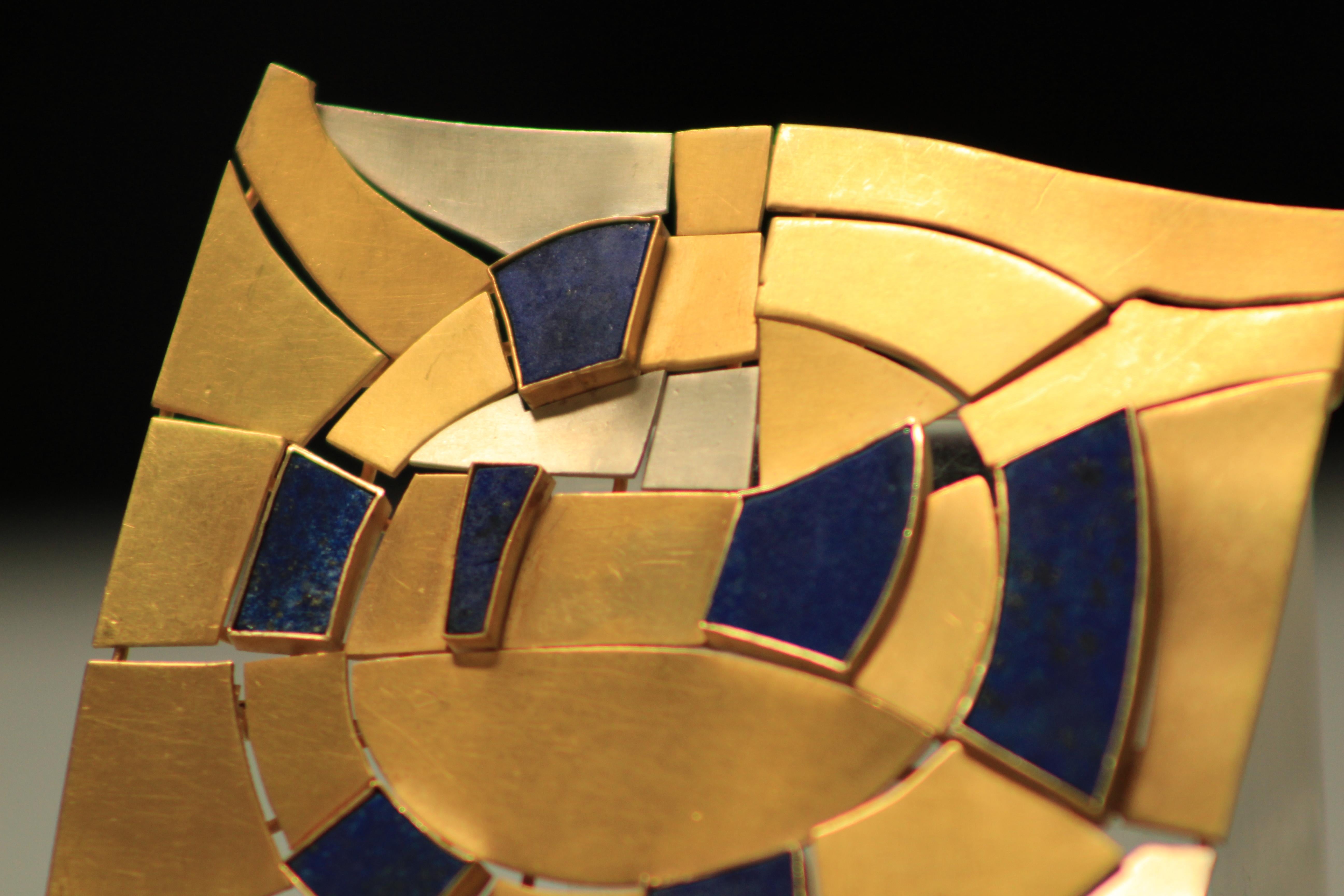 Modernist brooch in white and yellow gold, with lapis lazuli stones, designed by André Lamy one of the greatest artist from the famous belgian school 