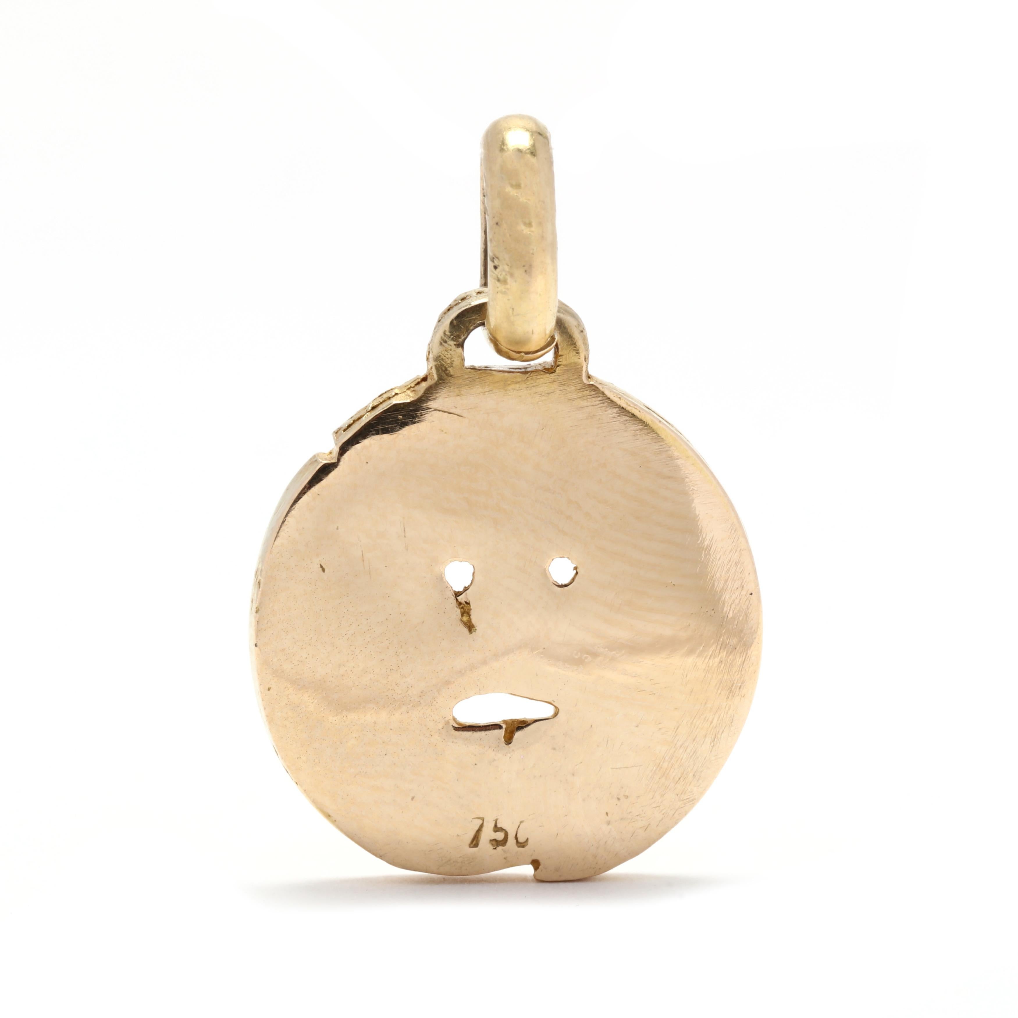 Un charme vintage en or jaune 18 carats 
