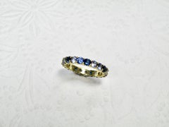 18k eternity ring with multi blue sapphires