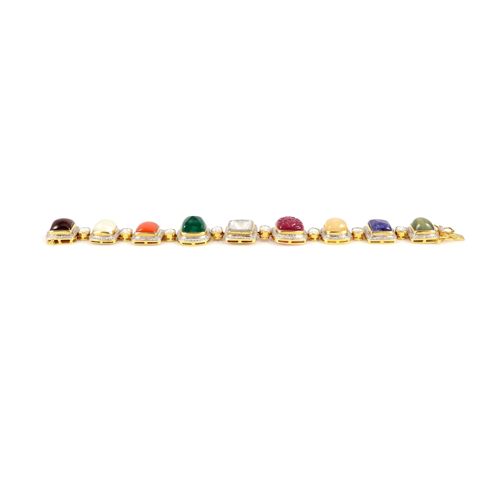 This exquisite multi-colored Navratan bracelet, crafted in 18K Yellow gold, is a stunning piece featuring a combination of vibrant gemstones in a spectrum of colors, elegantly set within the delicate links of the bracelet. Each stone is meticulously