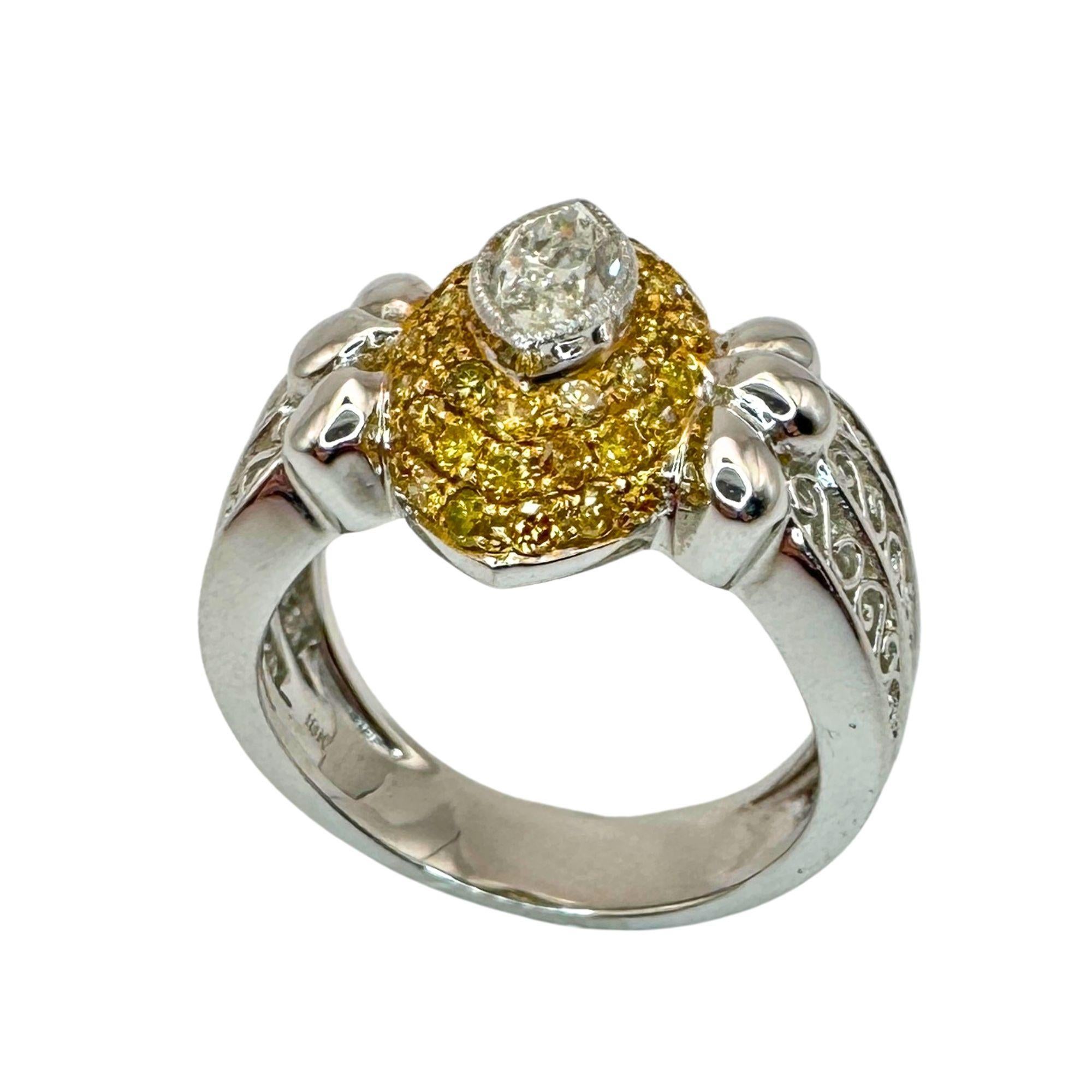 This 18k White Gold Marquise Cut Diamond and Yellow Diamond Ring, marked with 