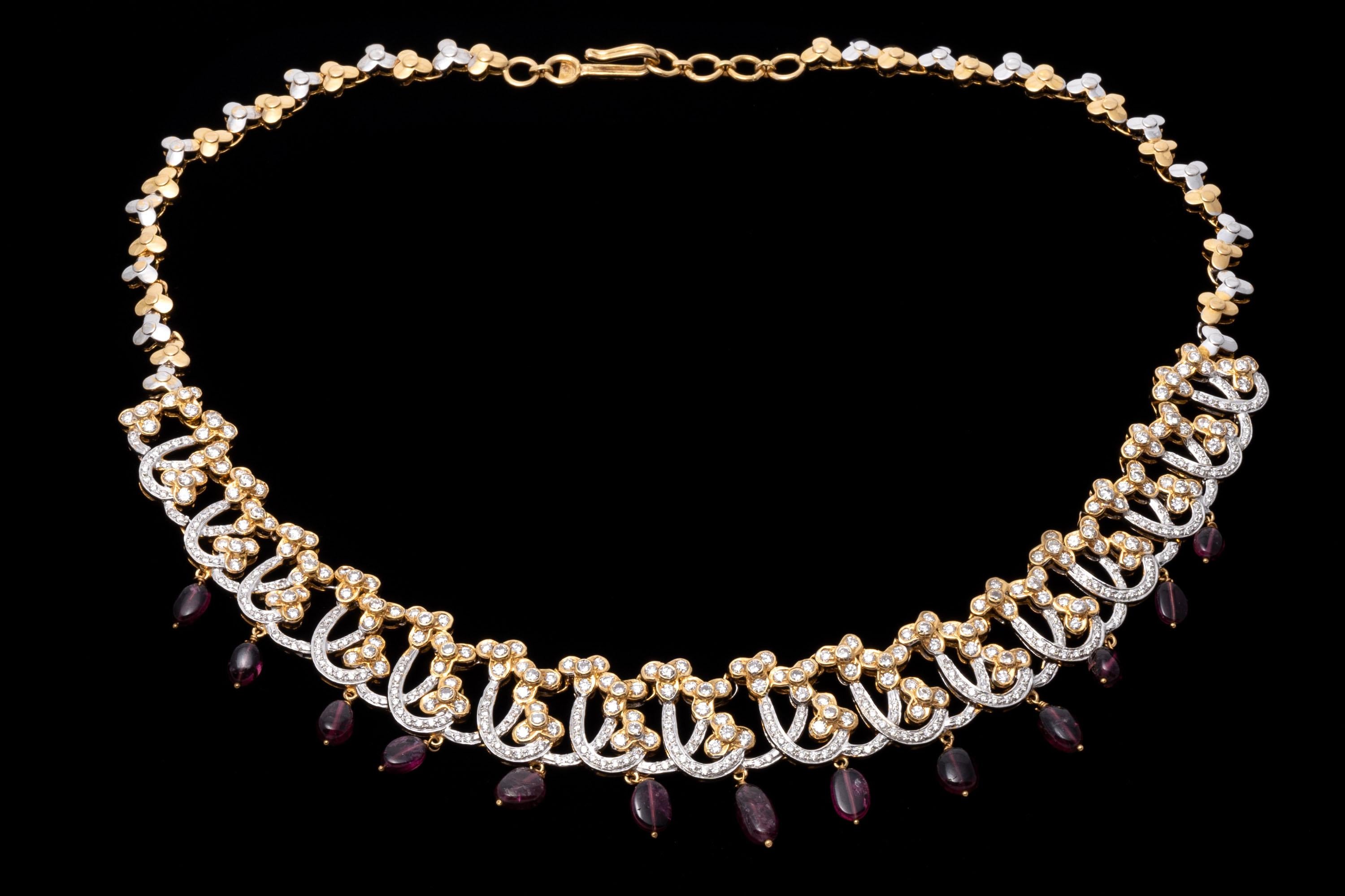 This 18K yellow gold necklace presents a dynamic design with and opulent frosting of round faceted diamonds. Suspended from the necklace are a fringe of pink tourmaline beads, adding a colorful touch to the piece. Diamonds are approximately 8.0 TCW.