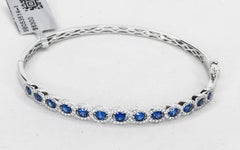 18 Karat Oval Blue Sapphires and Diamonds Bangle Bracelet