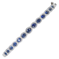 18 Karat Oval Blue Sapphires and Diamonds Bangle Bracelet