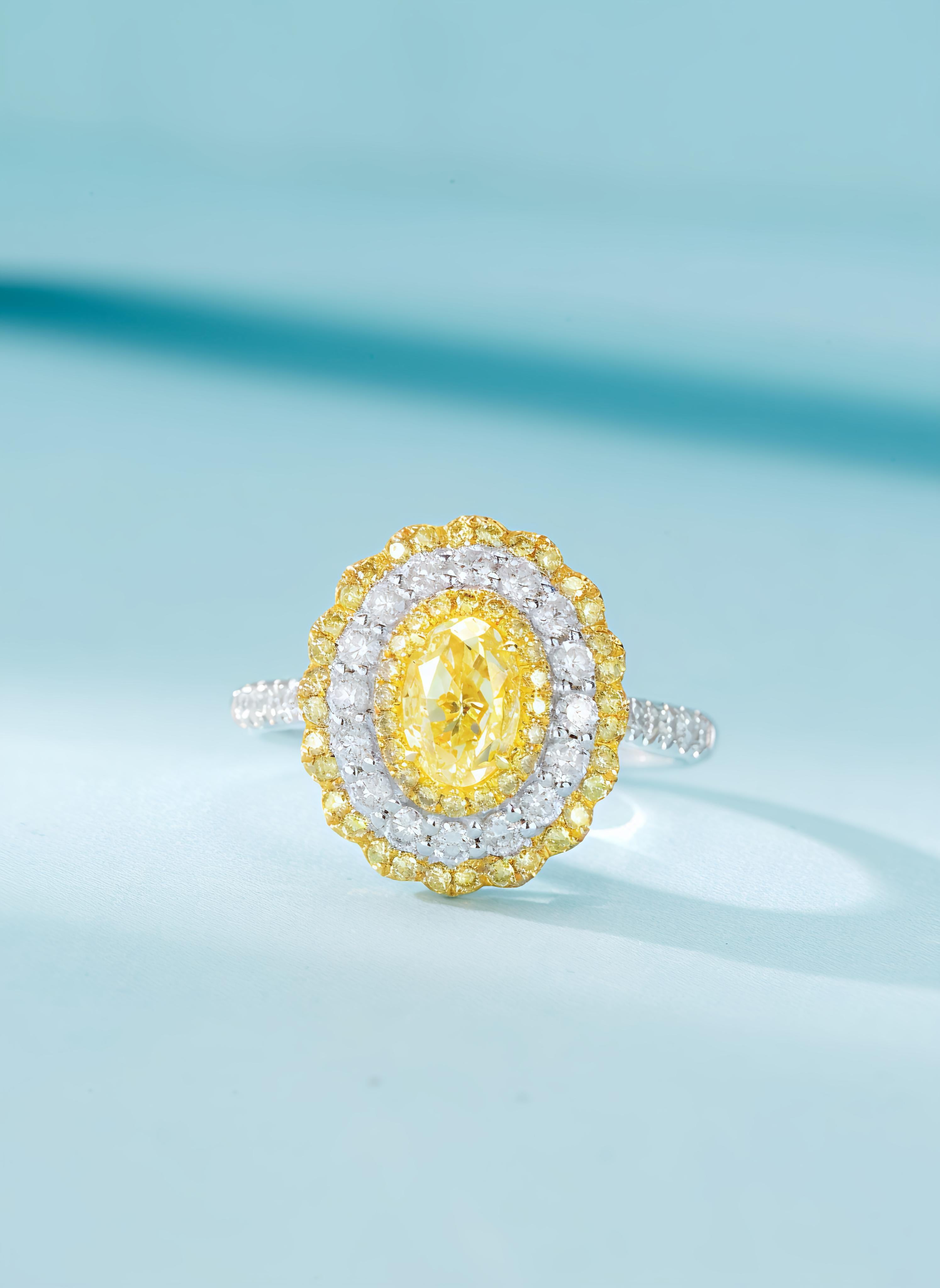 GIA Certified 1 Carat Oval-Cut Yellow Diamond Double Halo Ring/Pendant

Main Stone: Yellow Diamond - 1 Carat with GIA Certification  
Side Stone: Diamond - 0.9 Carat 
Total Weight - 5.33 GM

Unique Two-way Wear Design: This piece can be worn as both