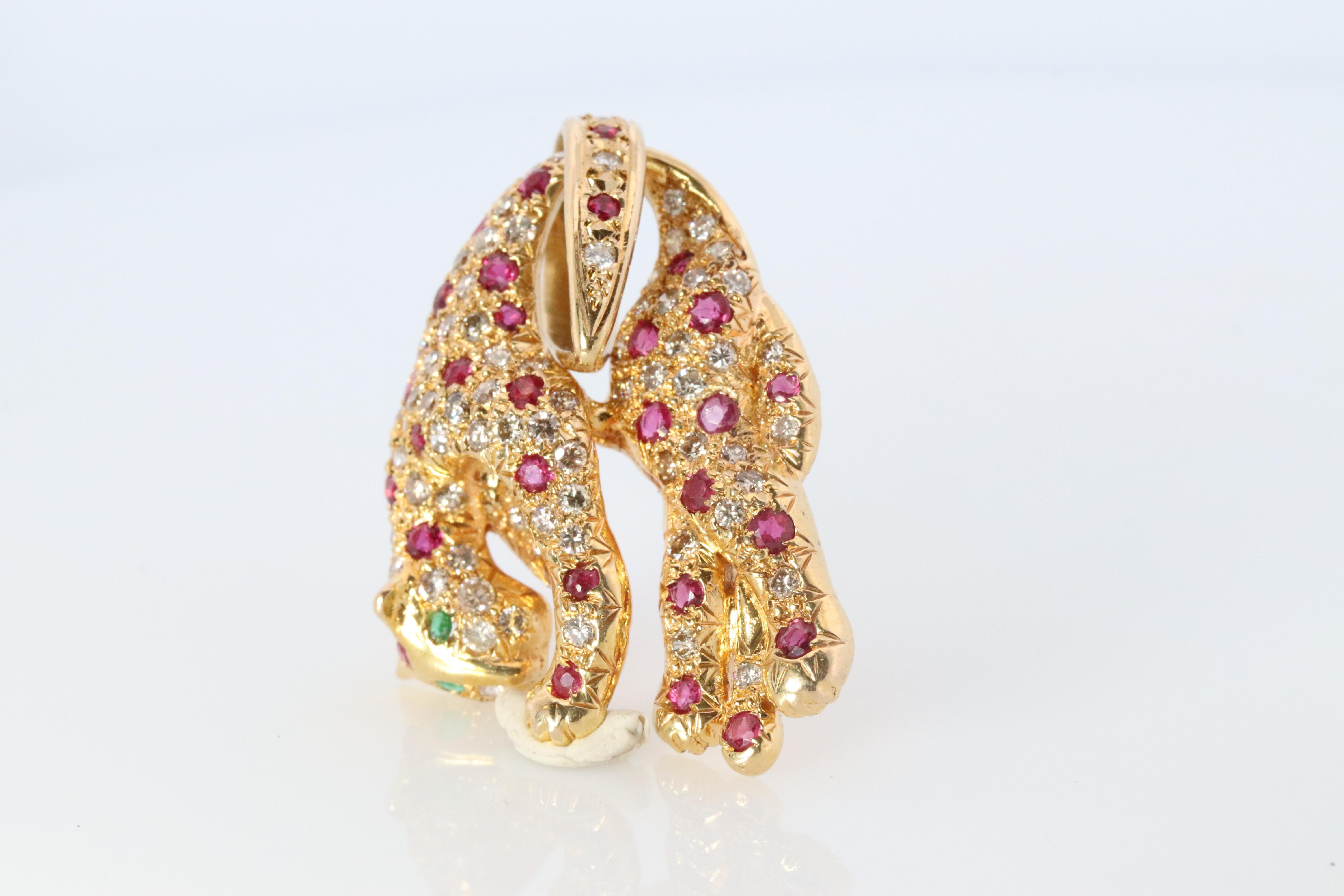 Panther Pendant

18k Yellow Gold
Beautiful encrusted Panther Leopard or Cheetah with Rubies, Diamonds.
Eyes are set with Emeralds.

Details:
10.5grams total weight
30mm by 24mm Pendant
BALE will fit a 8mm Chain

Hallmarked and tested 18k 750 Solid