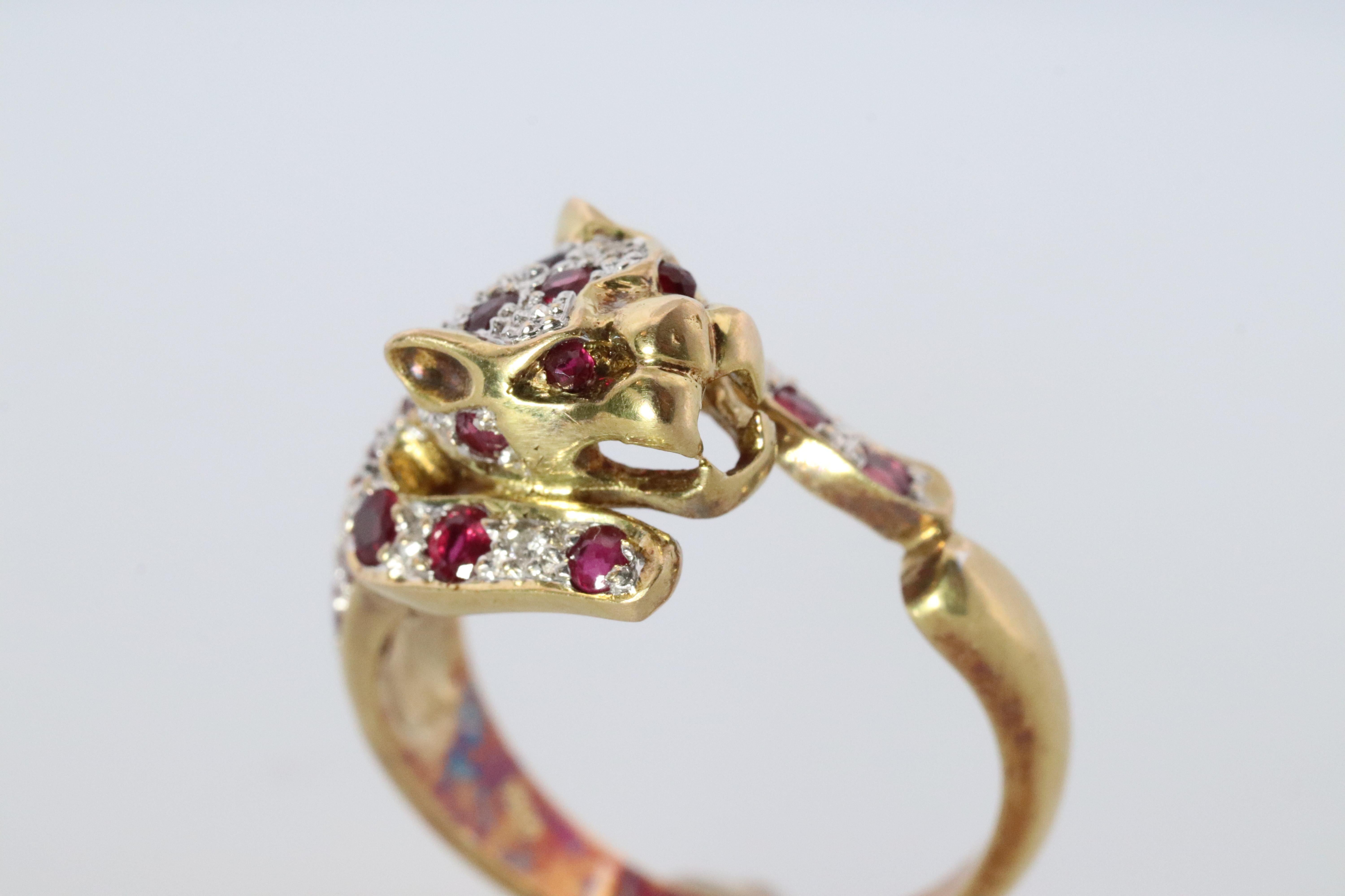18k Yellow Gold
Beautiful encrusted Panther Leopard or Cheetah with Rubies and diamonds.

5.5grams total weight

Details:

Size 7 ( can be reasonably resized, please inquire)
Wonderful and RARE piece.