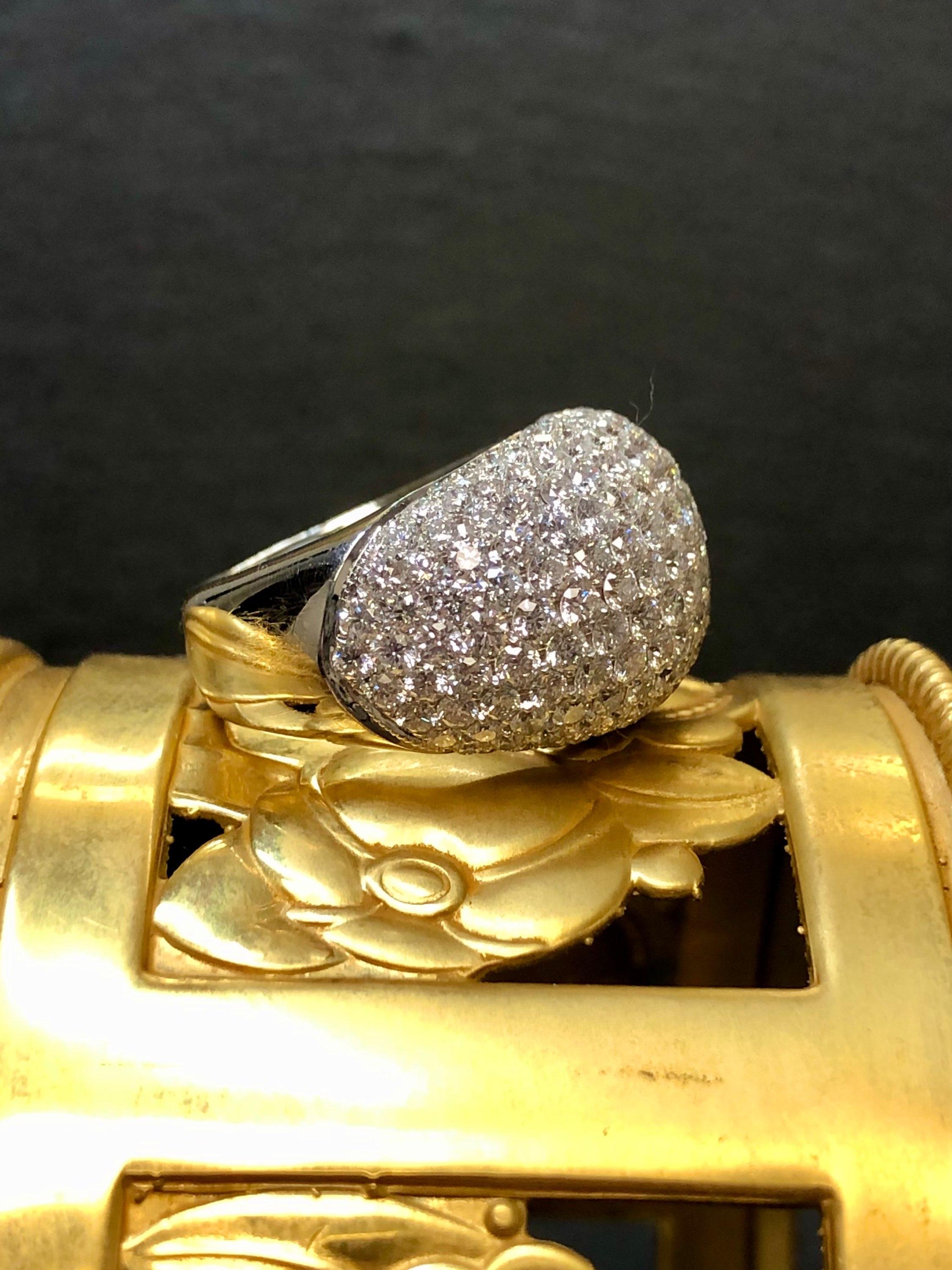 Very well made and expertly set pave diamond dome ring done in 18K white gold set with approximately 6.20cttw in G-H color Vs1-2 clarity round diamonds.

Dimensions/Weight
1” wide and .60” top to bottom. Size 7 1/4 (sizable). Weight is