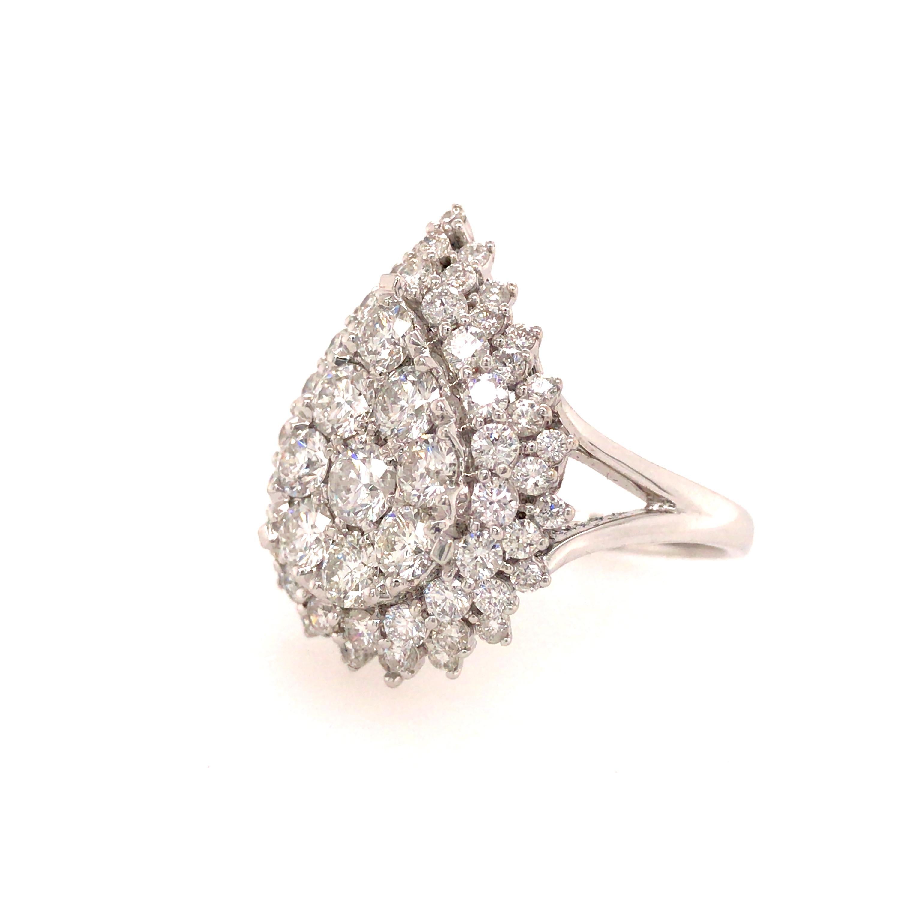 Pear Shape Diamond Cluster Ring in 18K White Gold.  (66) Round Brilliant Cut Diamonds weighing 2.75 carat total weight, G-H in color and VS-SI in clarity are expertly set.  The Ring measures 1 inch in length and 11/16 inch in width at the widest