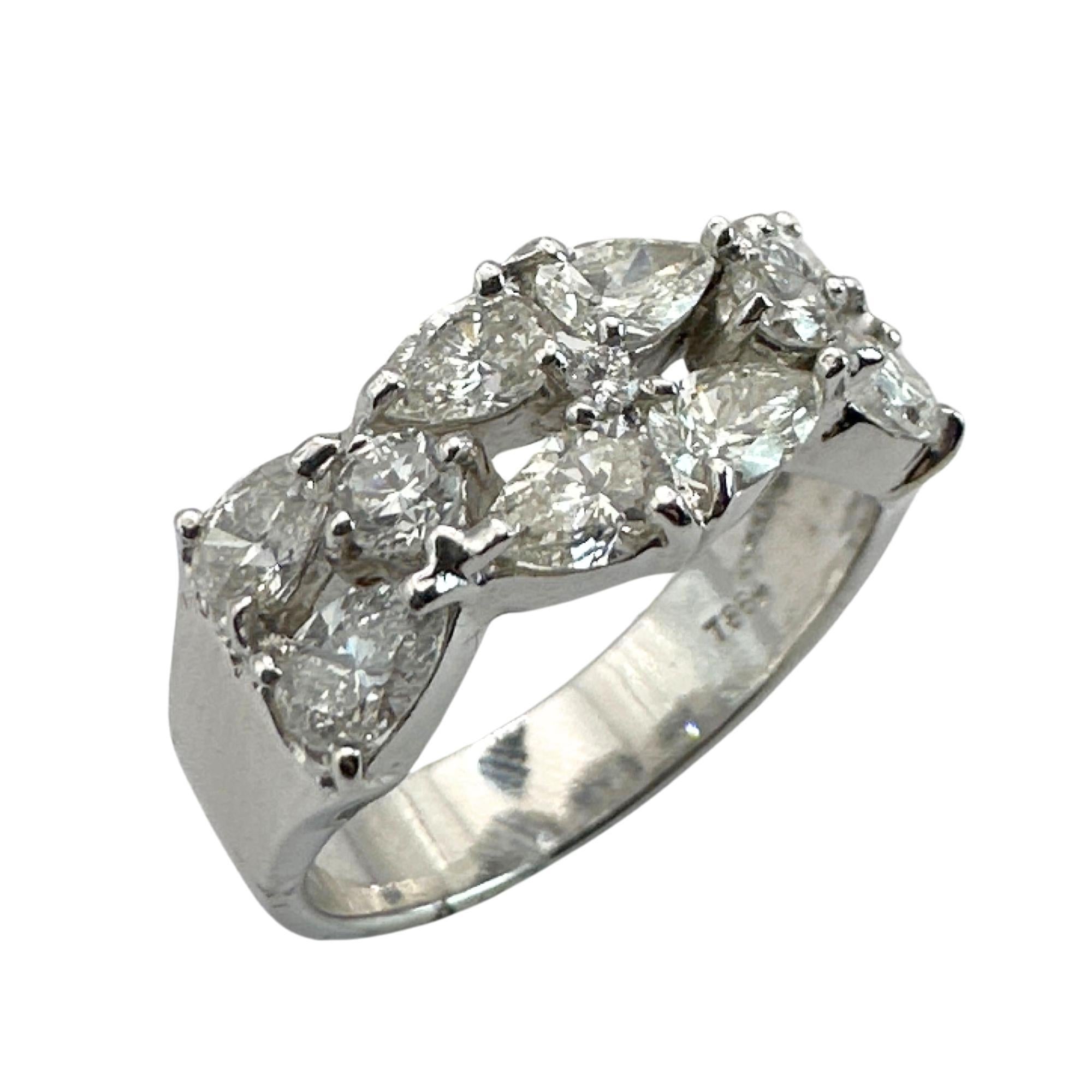 Indulge in luxurious elegance with this 18k White Gold Pear Shaped Diamond Band. Impeccably crafted with 1.85 carats of sparkling diamonds, this ring boasts a 13.18mm width. Adorned with intricate 