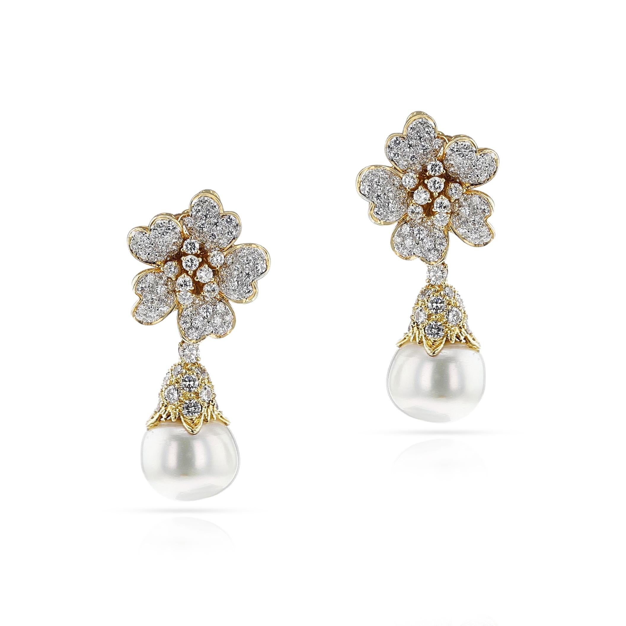 A pair of Pearl and Diamond Day and Night Earrings made in 18k Yellow Gold. The Diamonds are G color, VS clarity, appx. 4.50 carats. The total weight of the earring is 23.17 grams and the length is 1.75.