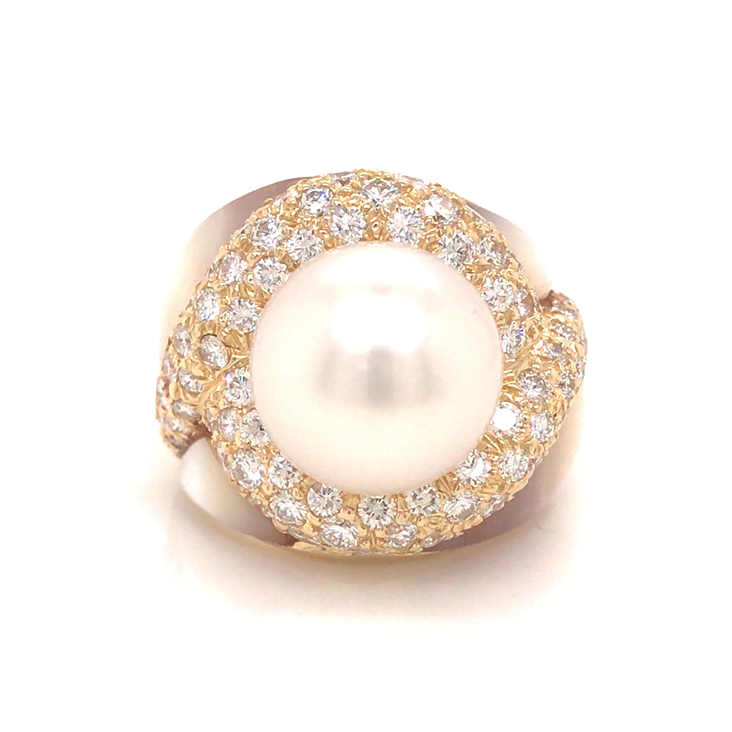 Pearl Diamond Ring in 18K Yellow Gold.  Round white mm Pearl expertly set surrounded by  Mother of Pearl and Round Brilliant Cut Diamonds weighing 3.55 carat total weight, G-H in color and VS in clarity.  Ring size 6.  The Ring measures 3/4 inch in