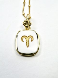 18k pendant. Astrological Aries carved in Cocholite. Gold lotus bail.
