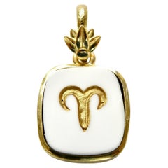 18k pendant. Astrological Aries carved in Cocholite. Gold lotus bail.