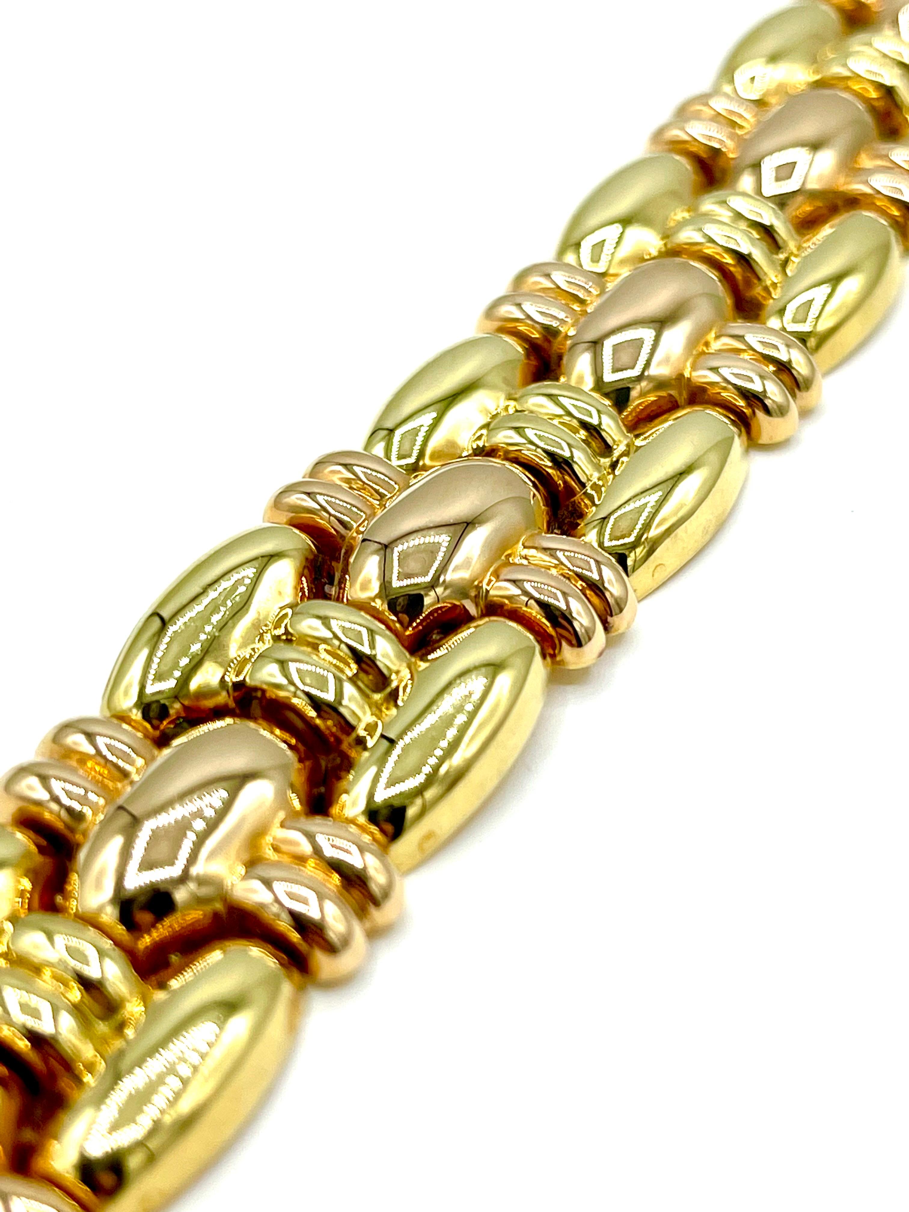 This is a beautifully made bracelet!  The bracelet features alternating links of pink and yellow 18K gold, with a hidden box clasp.  the bracelet measures 7.75 inches in length, and the clasp is stamped 