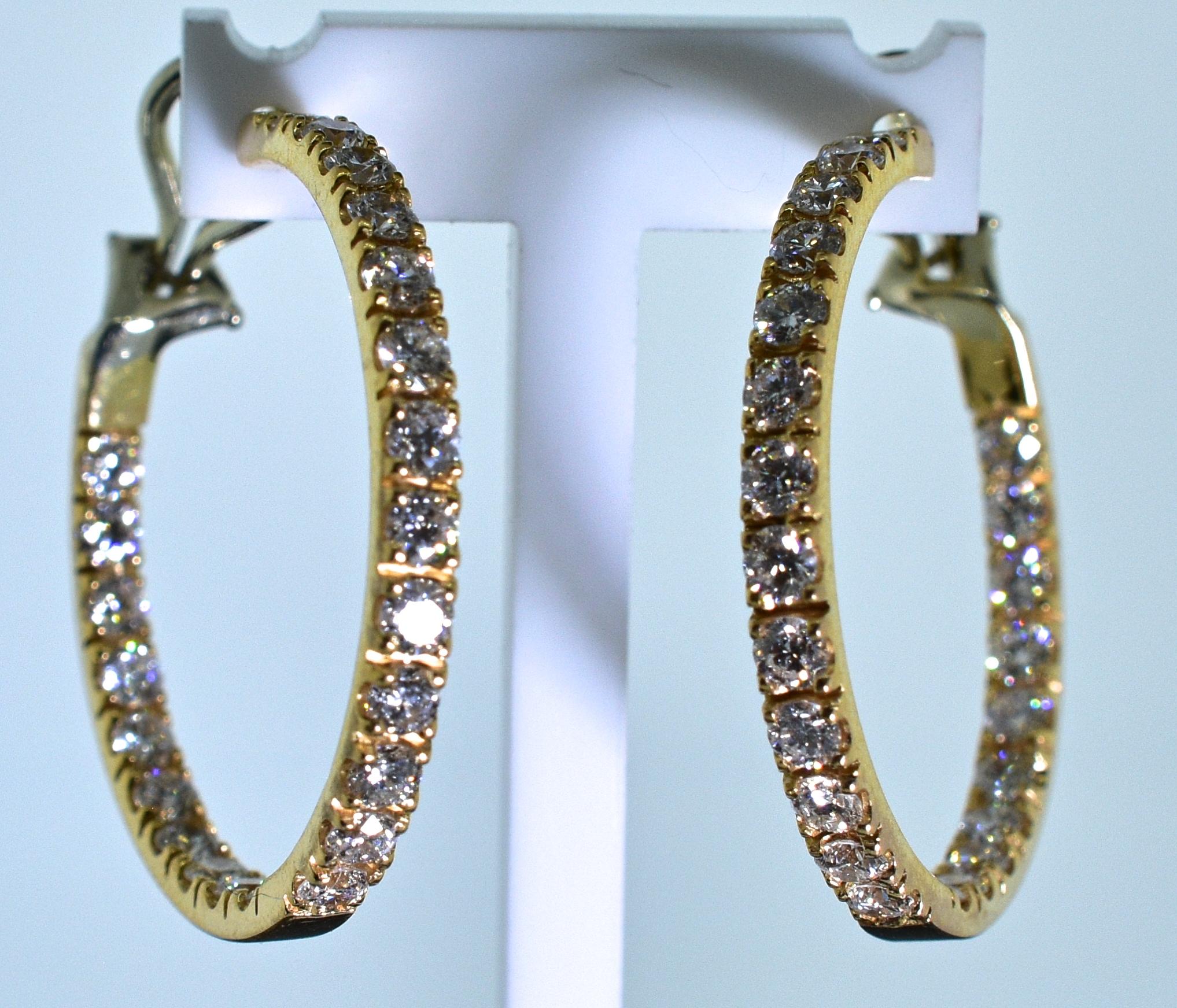 18K pink gold and diamond medium size hoops with 46 fine white round brilliant cut diamonds amounting to approximately 2.75 cts.  These 