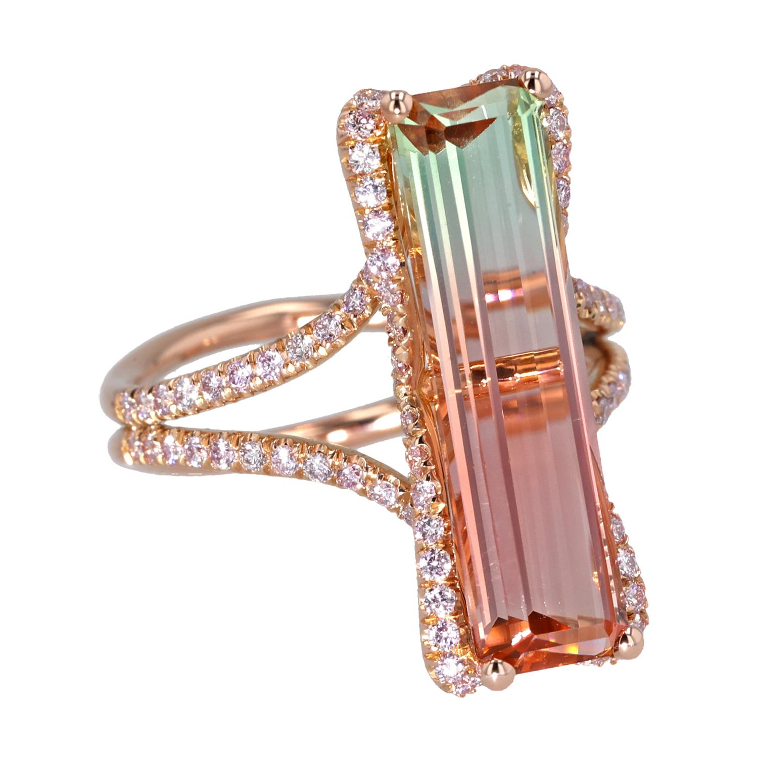 Step into a world of enchanting elegance with this exquisite 18K pink gold ring, a breathtaking creation by the esteemed designer J. Fine. The centerpiece of this remarkable ring is a stunning 5.49-carat bi-color tourmaline, a gemstone renowned for