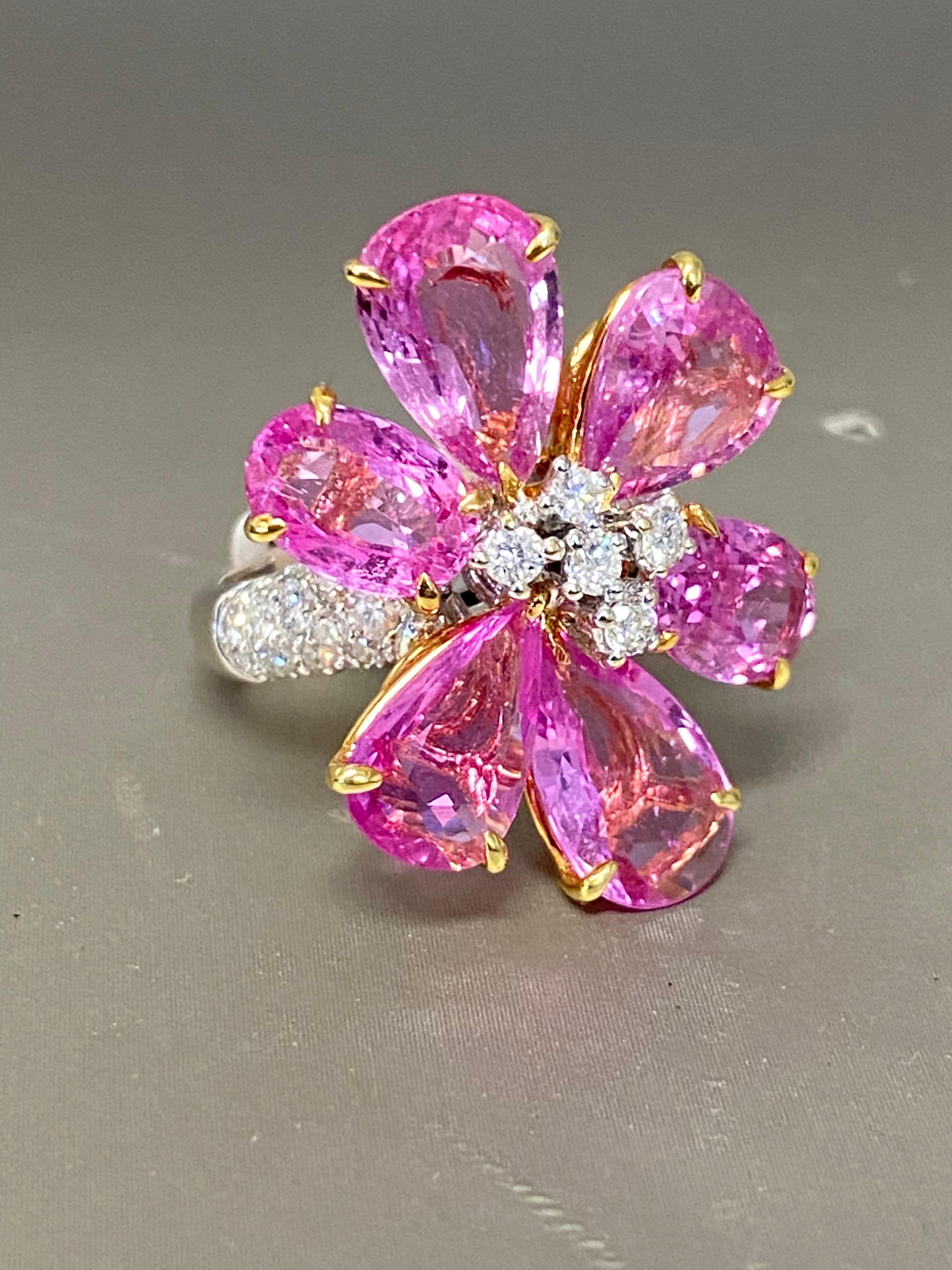 18K Pink 3.00 carat Sapphire Flower Petal Ring 
Vibrant-colored, sapphires are pear-shaped and set in a flower style in 18-karat white gold.

The color is a bright pink with a cluster of diamonds, centered, measuring 1.00 inches in diameter. The