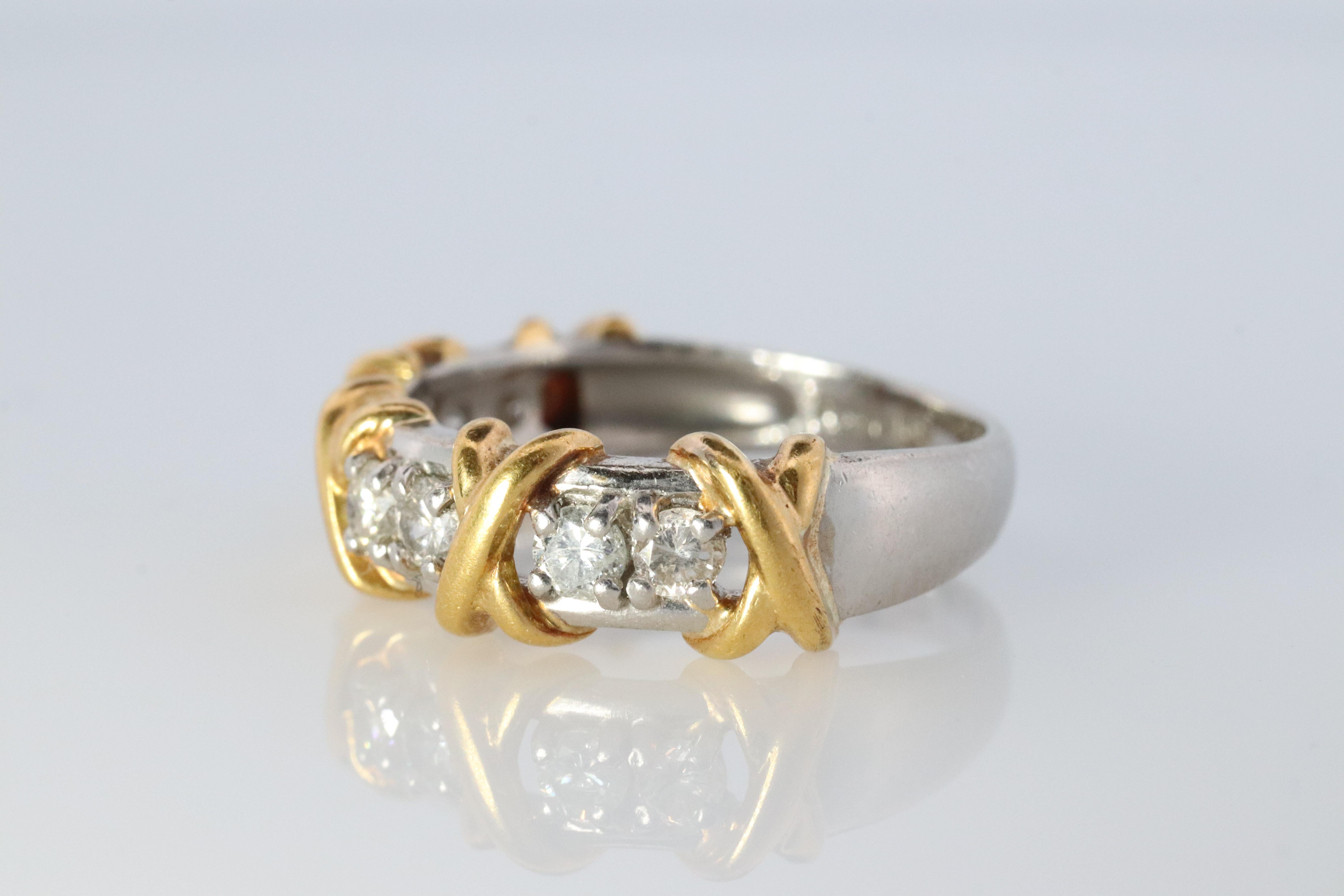 Stunning Diamond Band. Can be used as a wedding band.

18k Yellow Gold Crosses on PT900 Platinum shank.



Condition: Shows limited signs of wear

8 total diamonds 1/2ctw
5.1grams

size 6.25

6mm  width