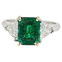 18K/Platinum GIA Certified 1.73 Carat Green Emerald and Trillion Diamond Ring