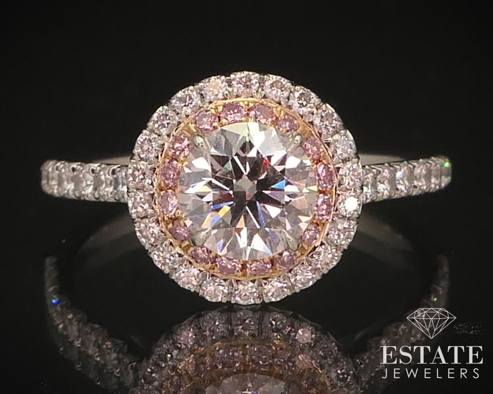 Sparkling double halo engagement ring from Tiffany & Co. Approximately 1.14ctw of round cut diamonds set on the double halo made of Platinum and 18k Rose Gold. Approximate .76ct laser inscribed main diamond with VVS2 clarity and H color. Pink and