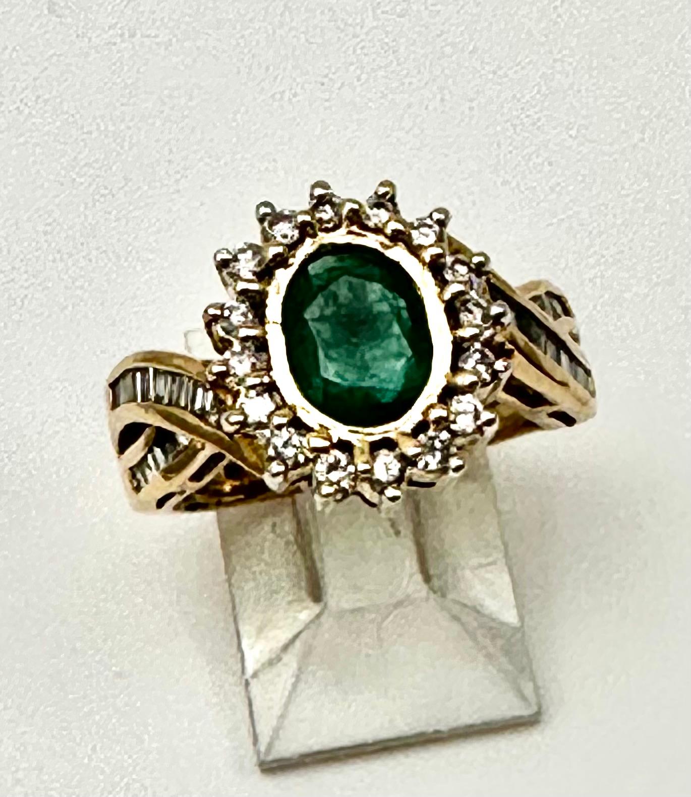 18k Ring Size Yellow Gold Diamond 5.5mm x 7.5mm Oval Emerald Ring Size 6 1/4
Top of ring measures approx 13mm x 14.3mm 

Emerald is a life-affirming stone. It opens the heart chakra and calms the emotions. It provides inspiration, balance, wisdom,