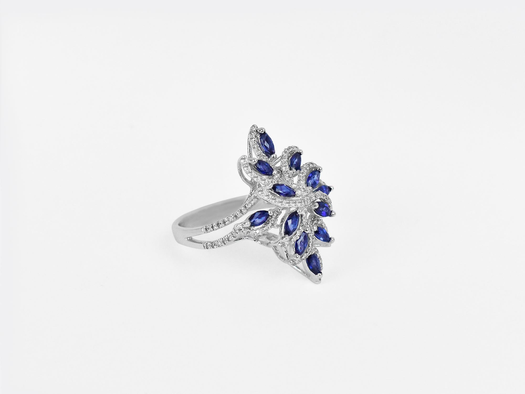 18k Ring White Gold Ring Diamond Ring  Blue Sapphire Ring  Blue Sapphire Marquise Ring  
         A fashion Art Noumea ring meticulously crafted to mesmerize. Each part of this art piece shows the passion for jewelry from Oshi Jewels Designs Inc. 
 