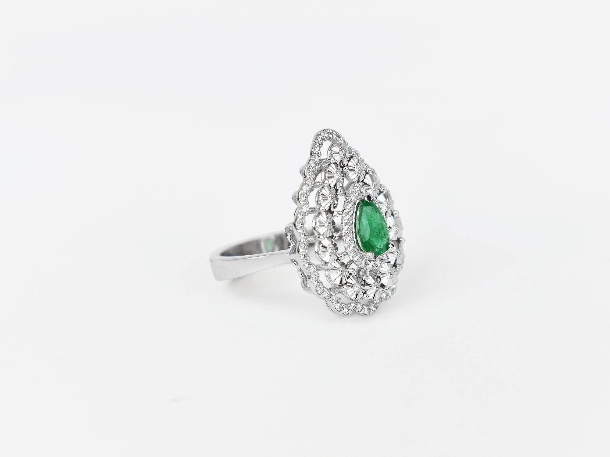 18k Ring White Gold Ring Diamond Ring  Emerald  Ring Emerald Pear Ring  Gold Fancy Ring
     This 18K solid white Gold Emerald / Diamond estate ring. The fine Quality gold finishing with pear shape Zambian emeralds & scintillating cluster pave set