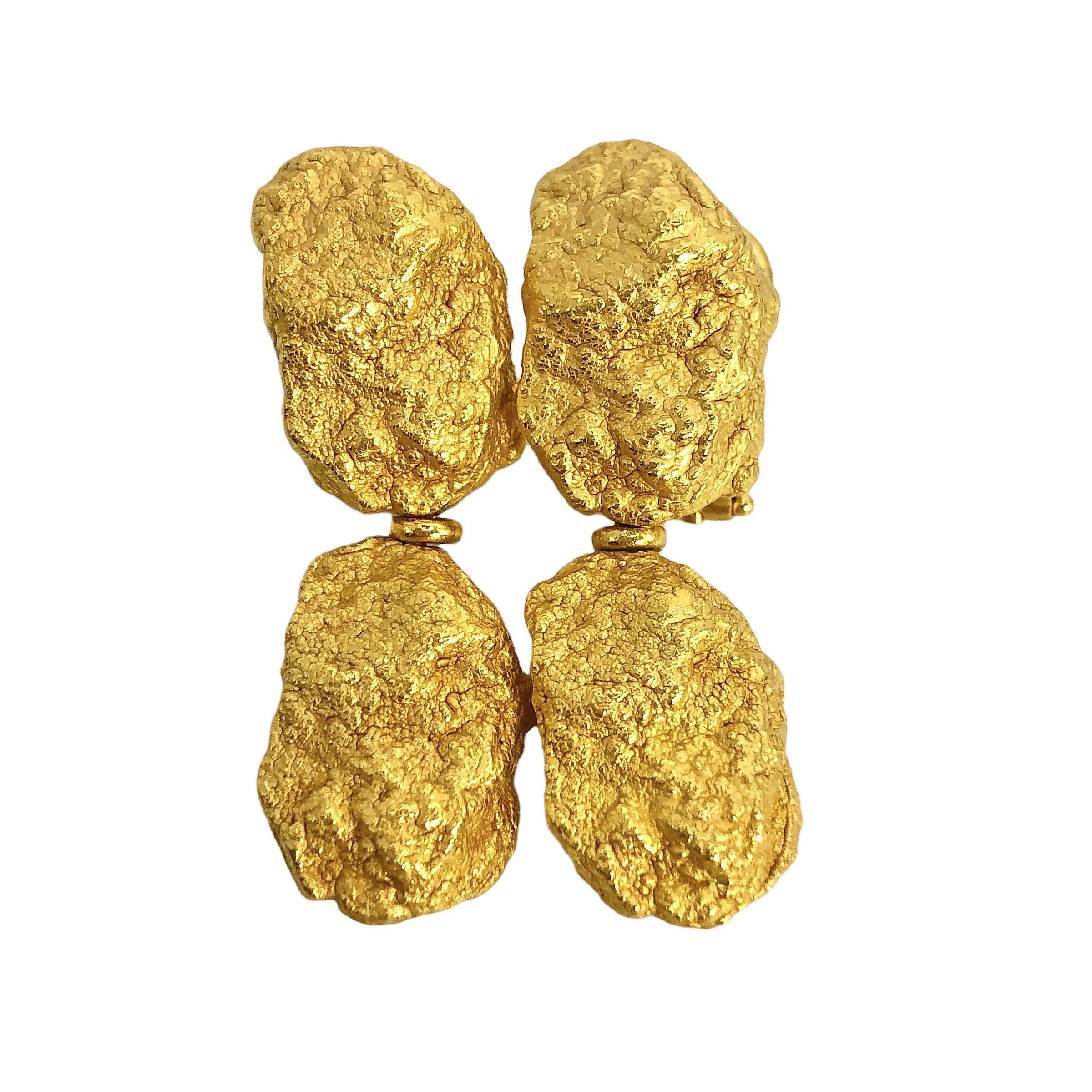 These chunky, Roberto Coin 18K yellow gold earrings depict the look of fine gold nuggets, extracted right from the gold mine. The earrings have a pure 24k gold wash, applied in the makers workshop, which completes the illusion that these are real