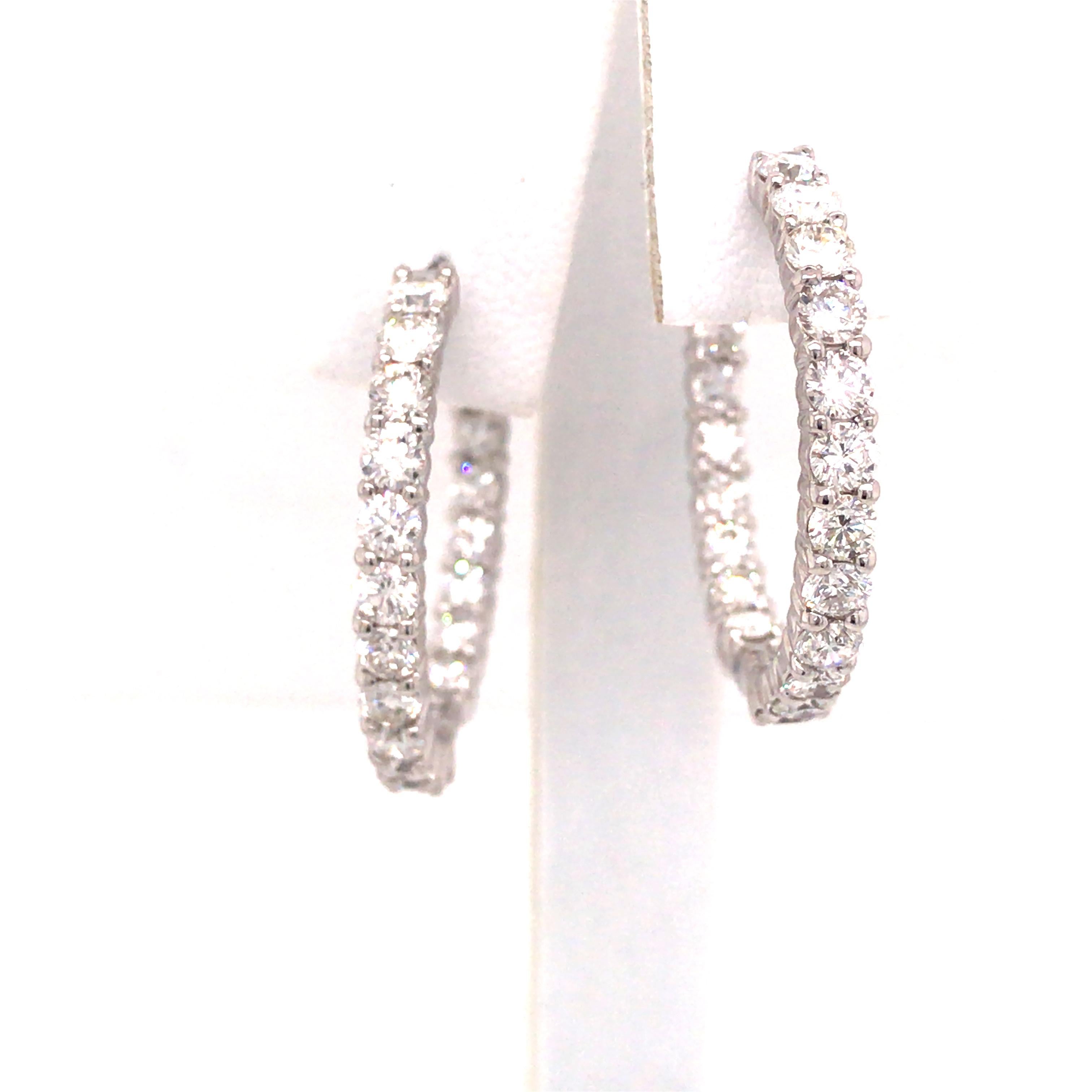 Roberto Coin Diamond In/Out Hoops in 18K White Gold.  (44) Round Brilliant Cut Diamonds weighing 4.40 carat total weight, G-H in color and VS-SI in clarity are expertly set.  The Earring measure 1 inch in diameter and 1/8 inch in width.  Stamped