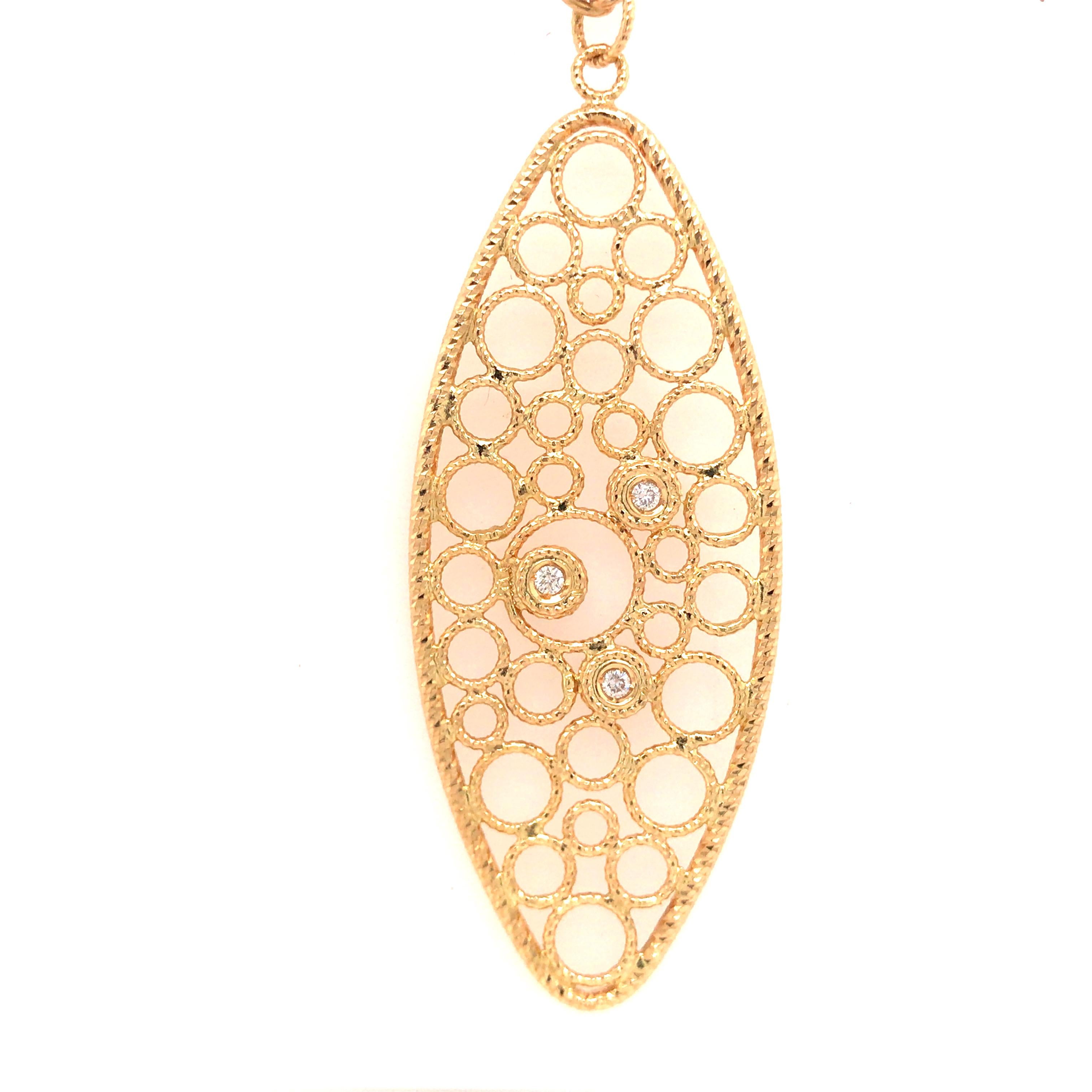 Roberto Coin Diamond Open Circle Pendant in 18K Yellow Gold.  Round Brilliant Cut Diamonds weighing 0.09 carat total weight, G-H in color and VS in clarity are expertly set.  The Pendant measures 1 1/2 inch in length, 7/8 inch in width.  The chain