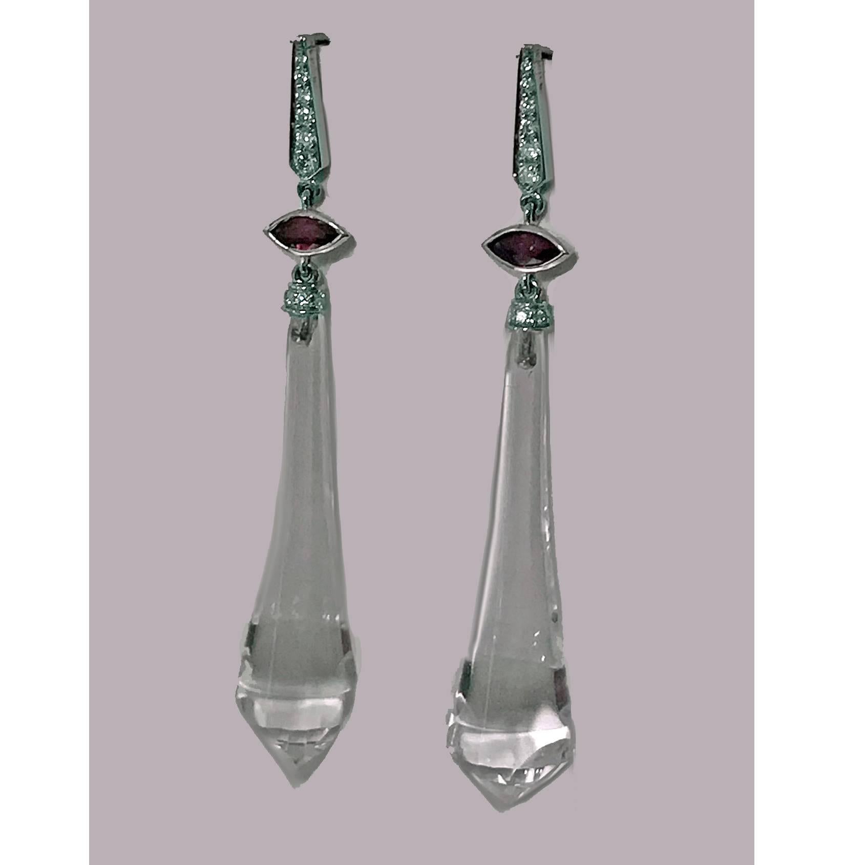 18K white gold and carved rock crystal diamond and ruby drop earrings, custom made. Each of torpedo shape set at the top with marquise faceted red ruby and 12 full cut diamonds, 0.36 ct, average SI clarity, G colour, hook fitments. Drop: 2.5 inches.