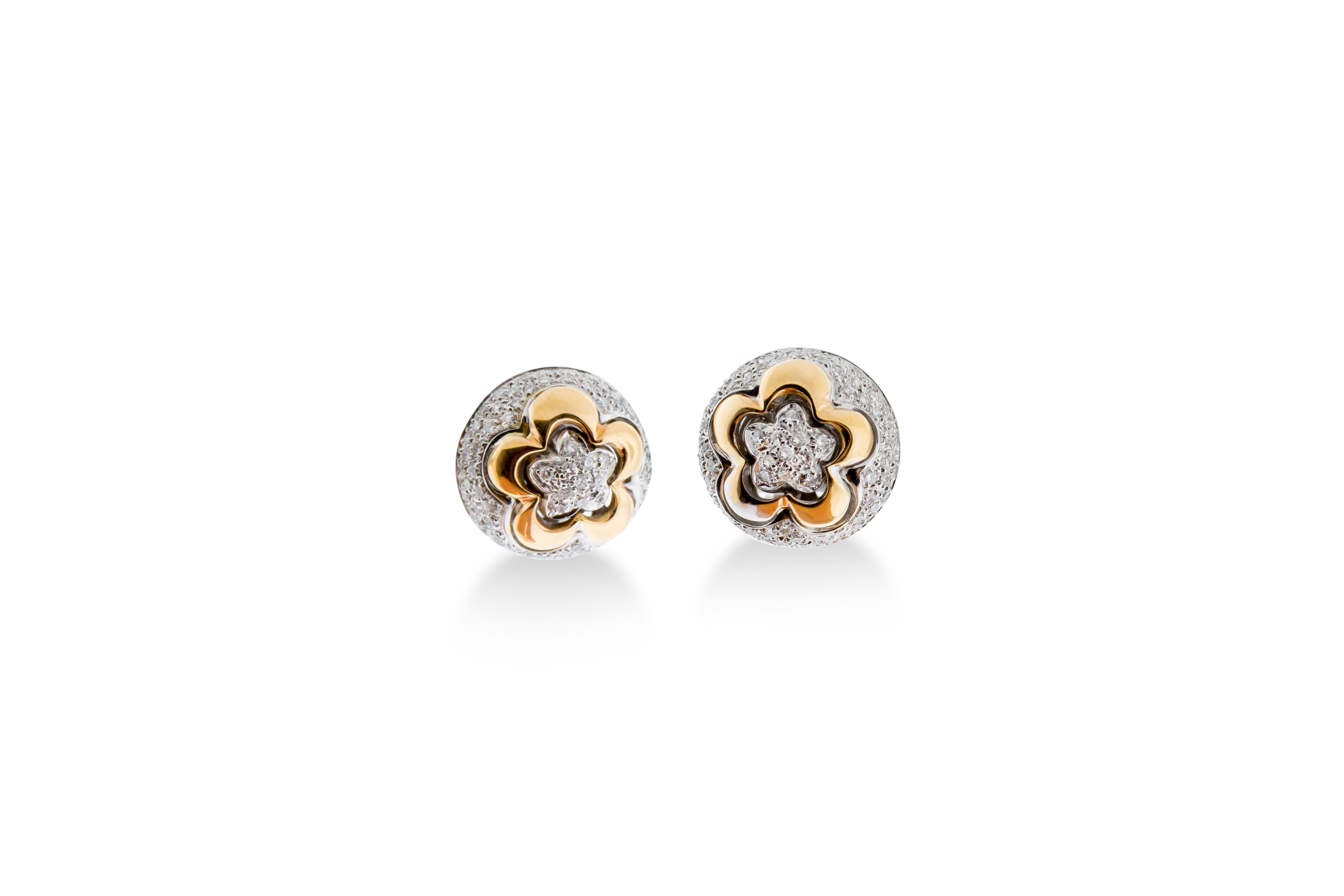 A pair of ear clips featuring 1.44 carats of G-H VS round diamonds set in 12 grams of 18K rose and white gold. 16mm diameter.

Viewings available in our NYC showroom by appointment.