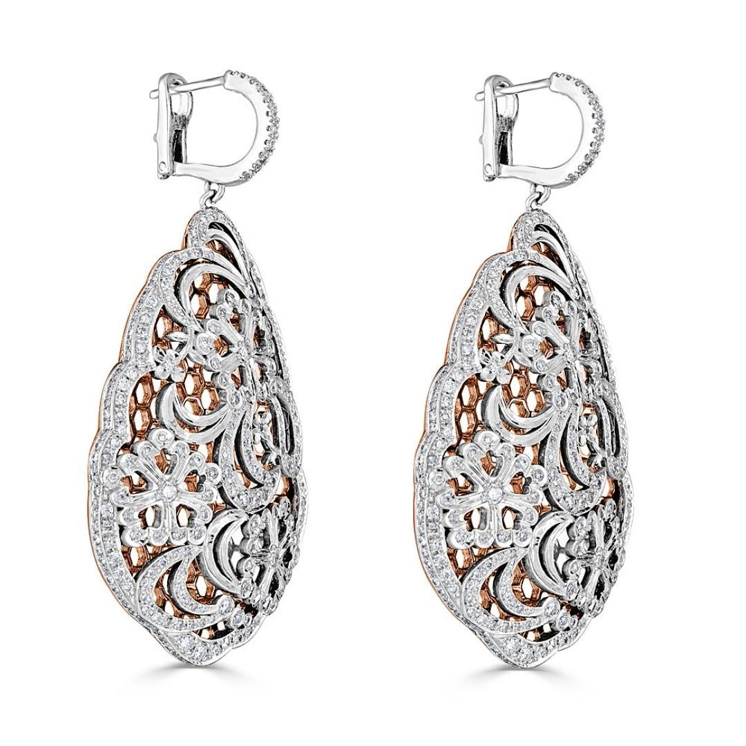 The complexity of the filigree design in this 18k rose gold Art Deco inspired drop earrings reflects the modern and sleek spirit of the era. This delicate technique evokes the feeling of lace, and it was a very popular trend during the 1920s and