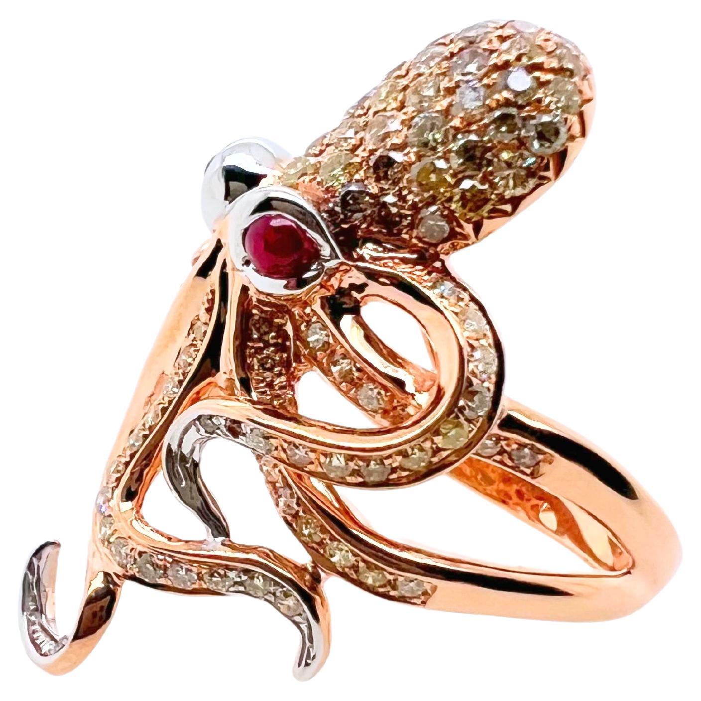 This unique ring is an art on finger.  The intricate details of this octopus ring will leave you speechless.  The octopus body is made of 18k rose gold with the ruby cabochon eyes that are set in 18k white gold.  The diamonds are set in a pavé set