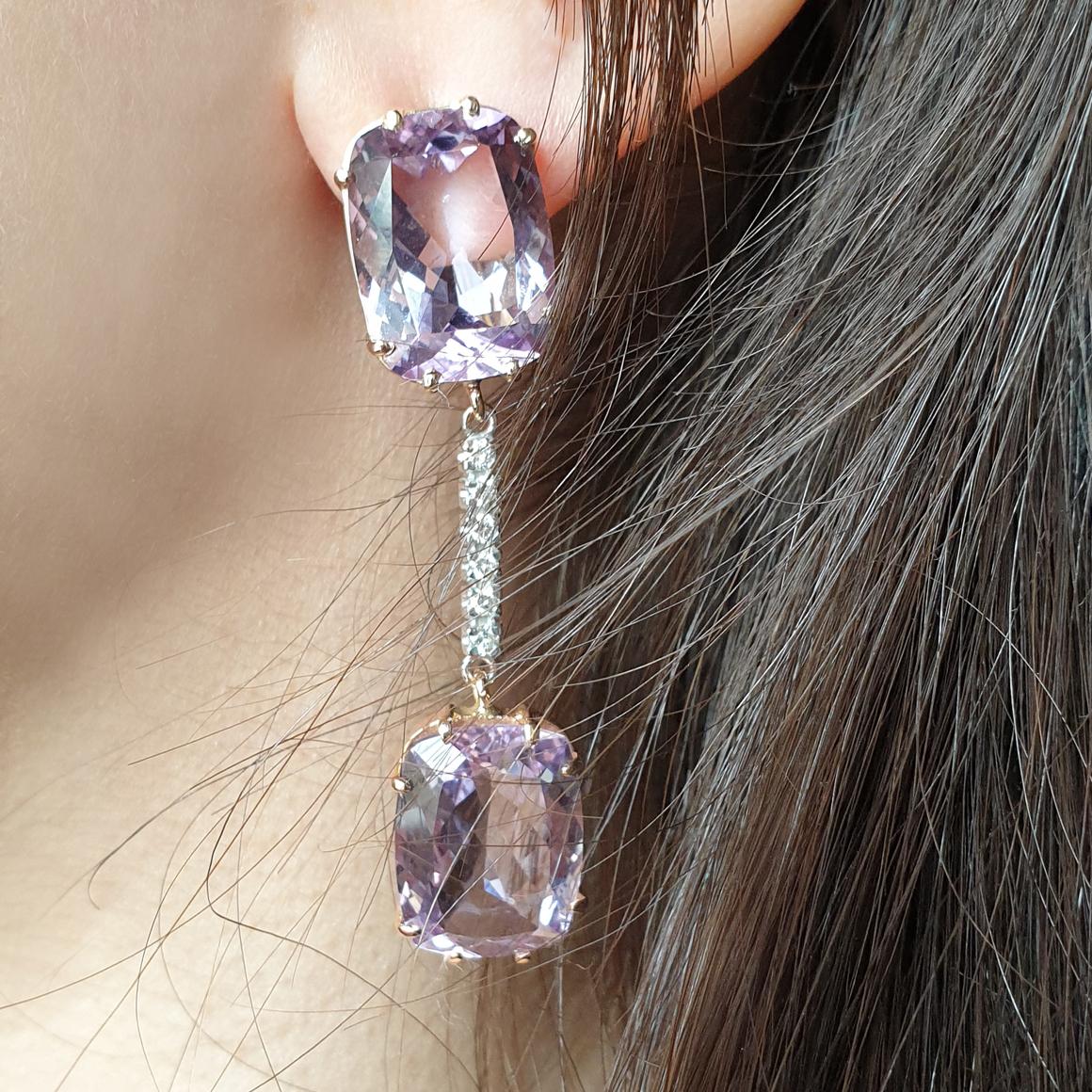 Earrings in 18k rose and white gold with Amethyst (rettangular cut size: 12x16mm) and white  Diamonds VS Color G/H cts 0,20
Fine Amethyst is trasparent , which means that the light passes throught the stones unhindered. The light colour of Amethyst