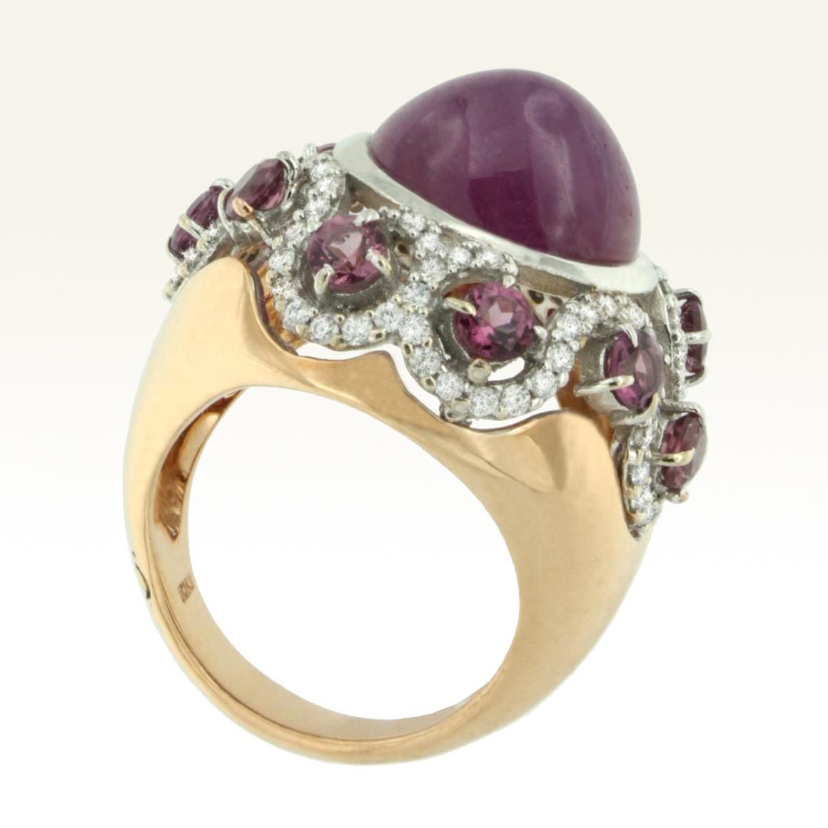 Ring in rose and white gold with oval cabochon Pink Ruby (size mm 11x13) cut Pink Tourmaline (size: 3.5mm),  and diamonds Karat 0.85  Total weight g.18.50
Amazing  ring of refined elegance,  the combination of the color of the stones and  the