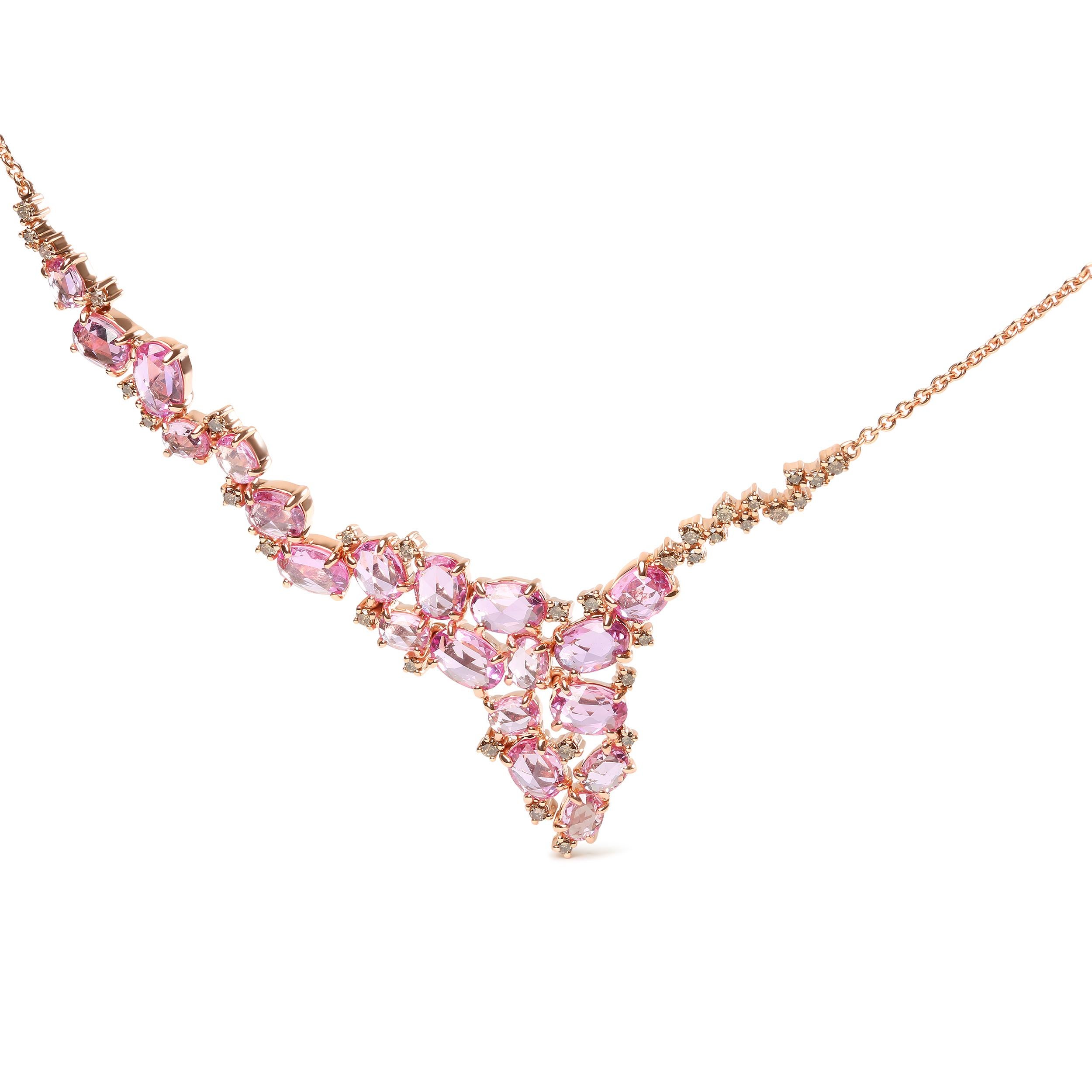 Placing an emphasis in sparkle, this cluster cascade station necklace dazzled in polished 18k rose gold with natural gemstones and diamonds. A unique arrangement of heat-treated pink sapphires in 8x5mm, 5x5mm, and 4x4mm ovals are scattered in a