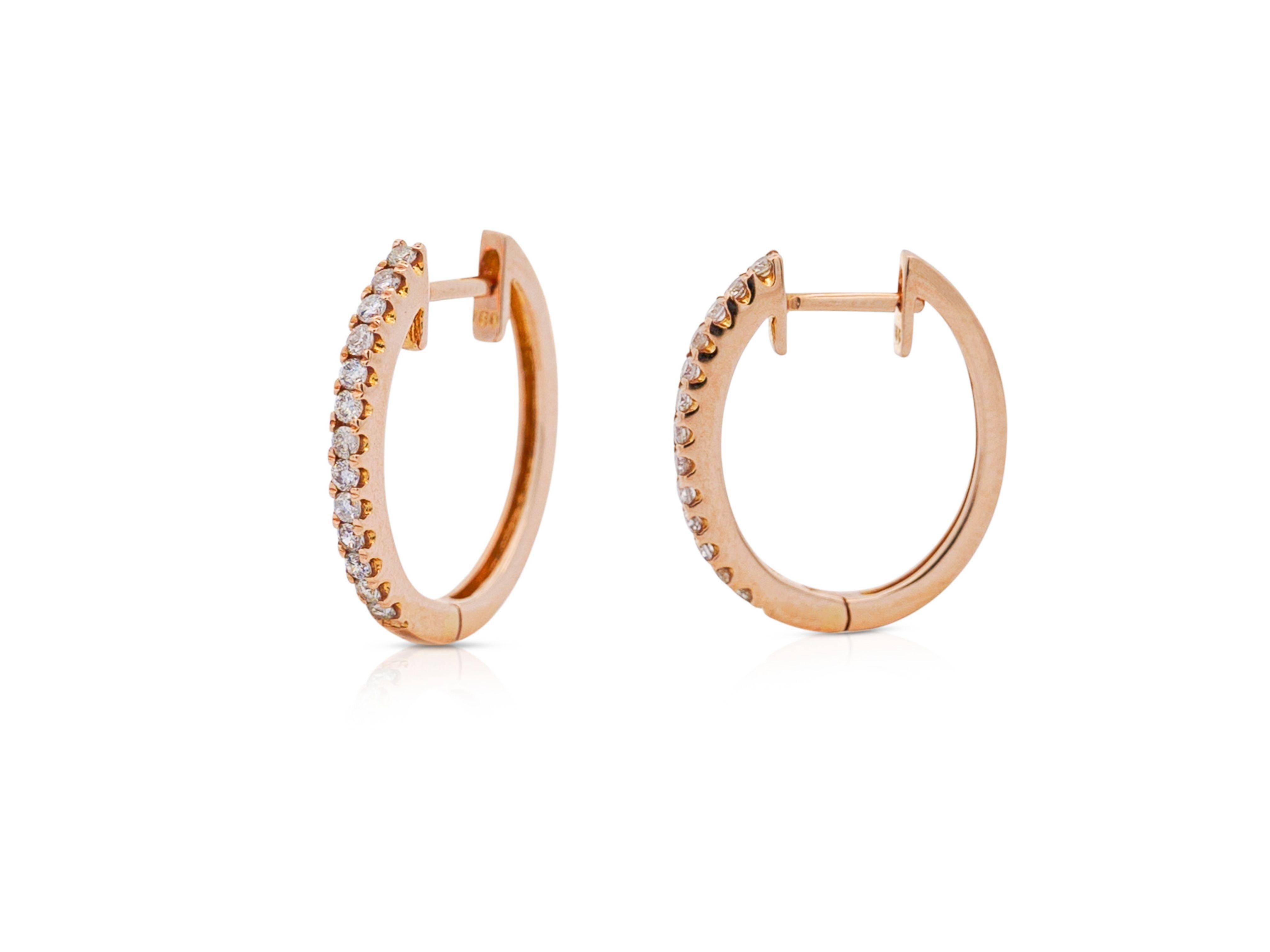Rose Gold hoop earrings with vibrant natural diamonds mounted in a pave set 18k rose gold latch back closure. The closure was engineered to clip on with maximum strength and durability. Set with eye clean white diamonds and a strong setting to