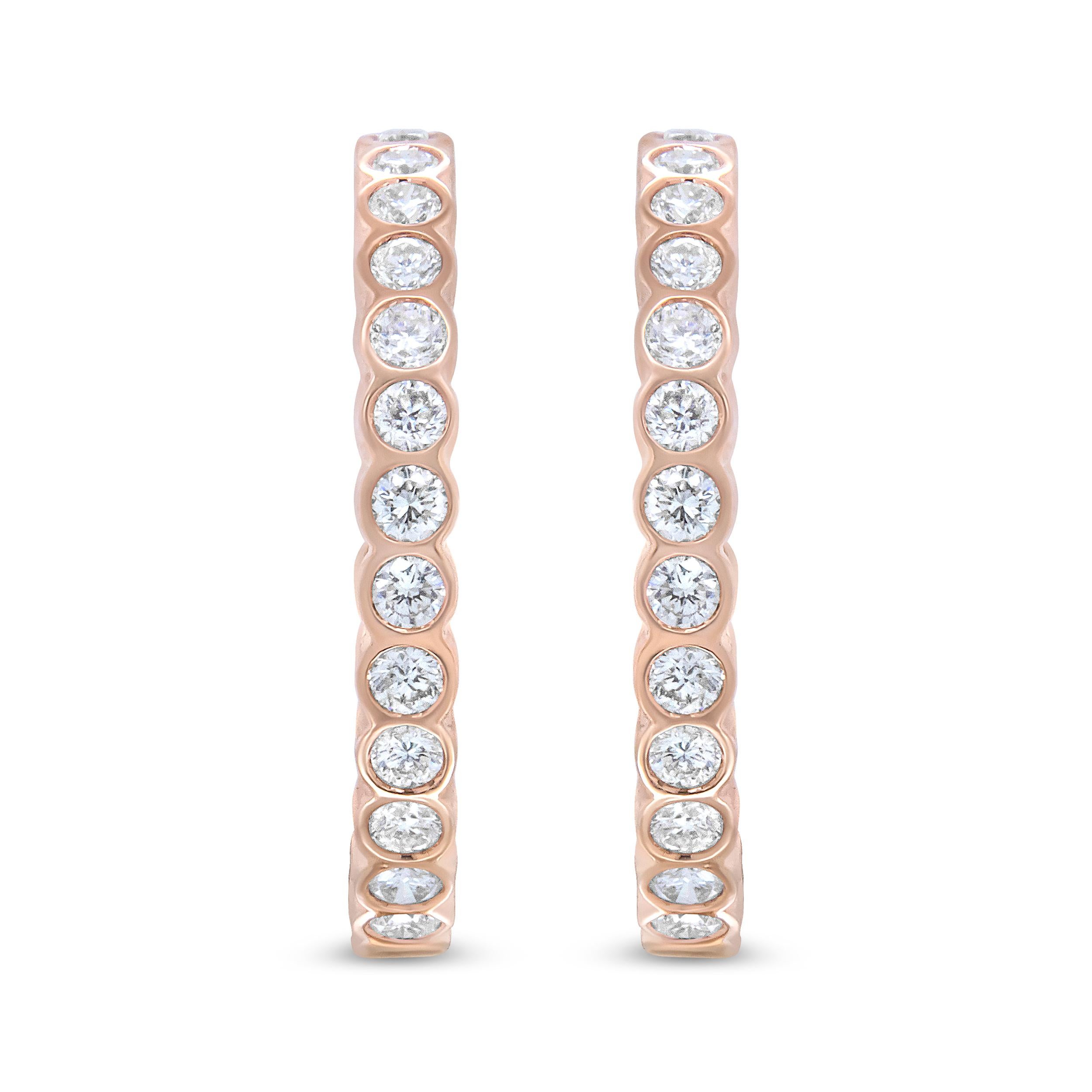 Every detail of this pair of 18k rose gold hoop earrings is crafted to perfection for a sparkling and captivating style that that is eminently wearable. A gorgeous arrangement of round white diamonds present their sparkle from the security of their