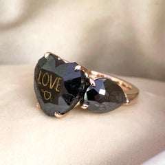 18 Karat Rose Gold 11.22 Carat Heart Shape Black Diamond Trilogy Ring
