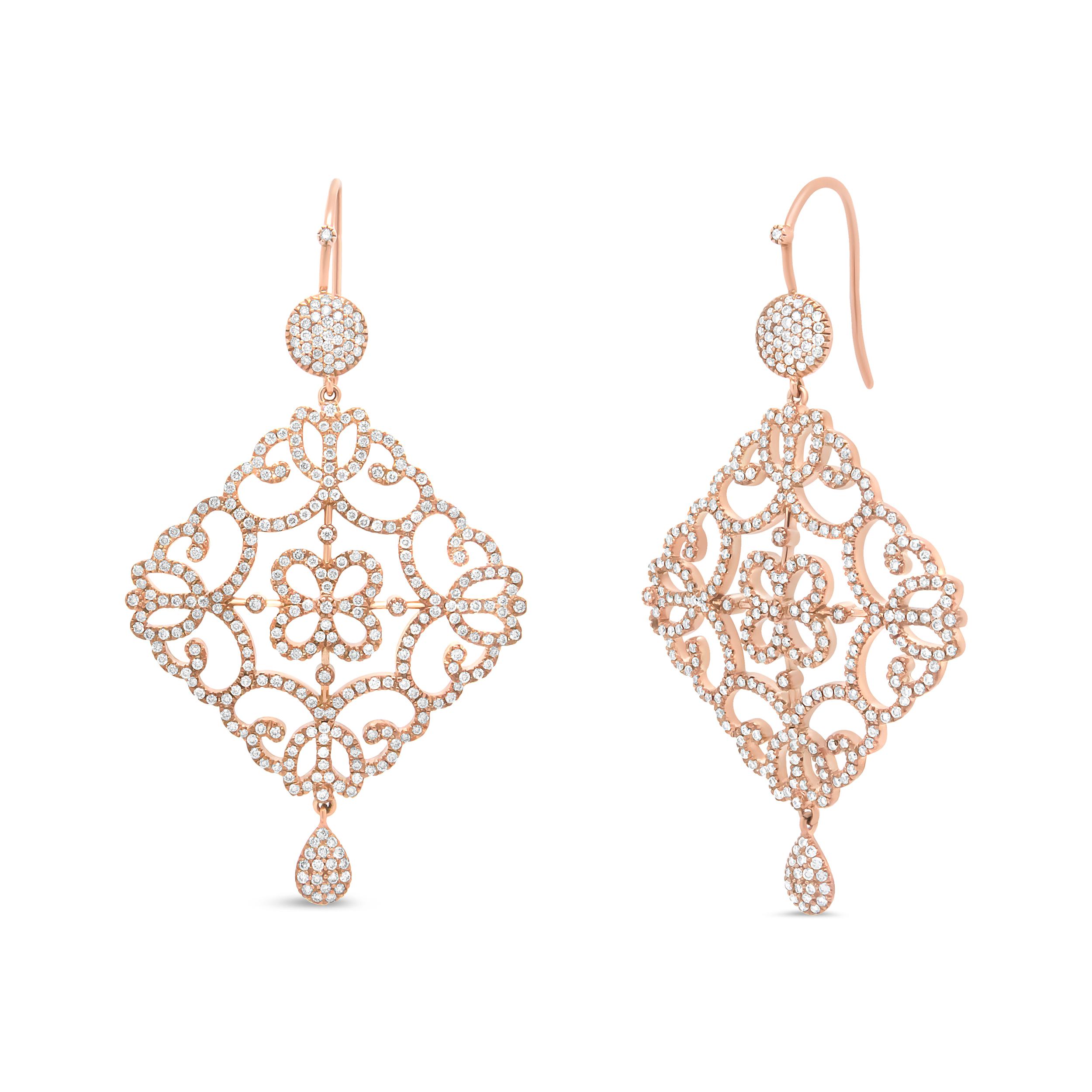 A feminine energy ignites the look of these gorgeous dangle drop earrings crafted from genuine 18k rose gold. An incredible sparkle emanates from the 620 round white diamonds that glisten from their prong settings. These glittering stones total 3