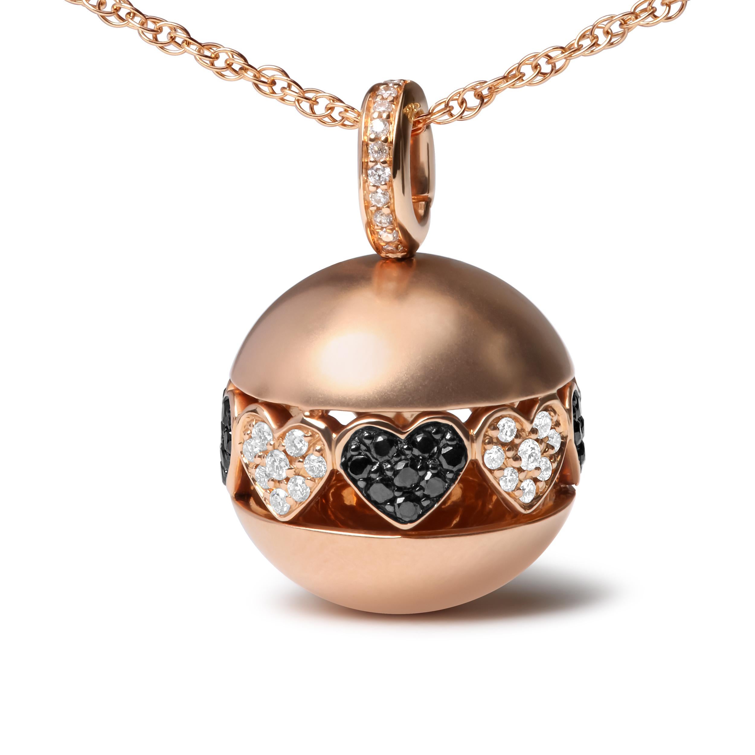 Cast in polished 18k rose gold, this ball drop pendant necklace showcases a design that is rich in symbolism. A single row of diamond-encrusted filigree heart silhouettes spread out around the perimeter of the ball, declaring a statement of love.