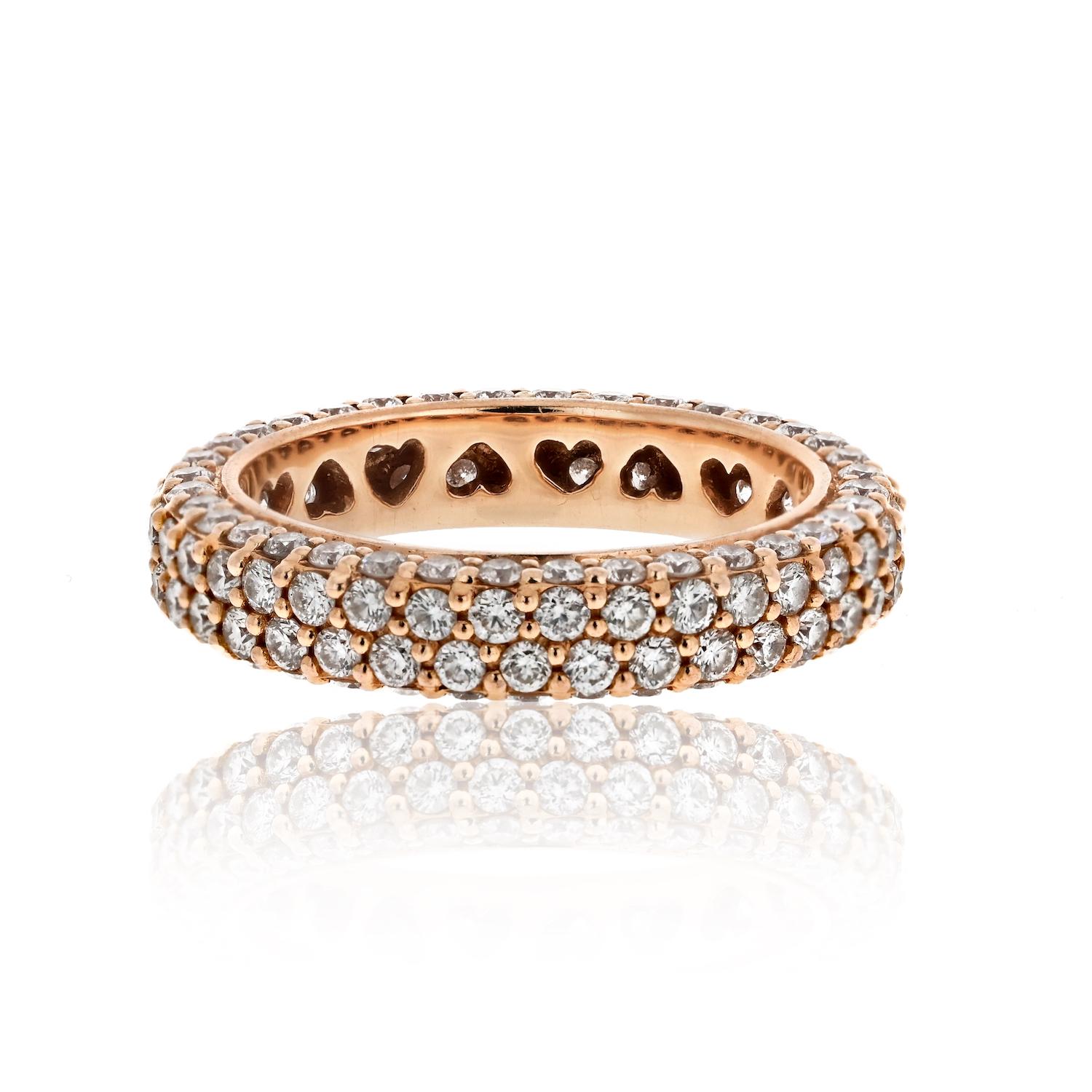 Indulge in the timeless elegance of our Diamond Eternity Band in 18k Rose Gold. This exquisite ring features four rows of round-cut diamonds, meticulously set to create a stunning display of brilliance. With a width of 4mm, it strikes the perfect